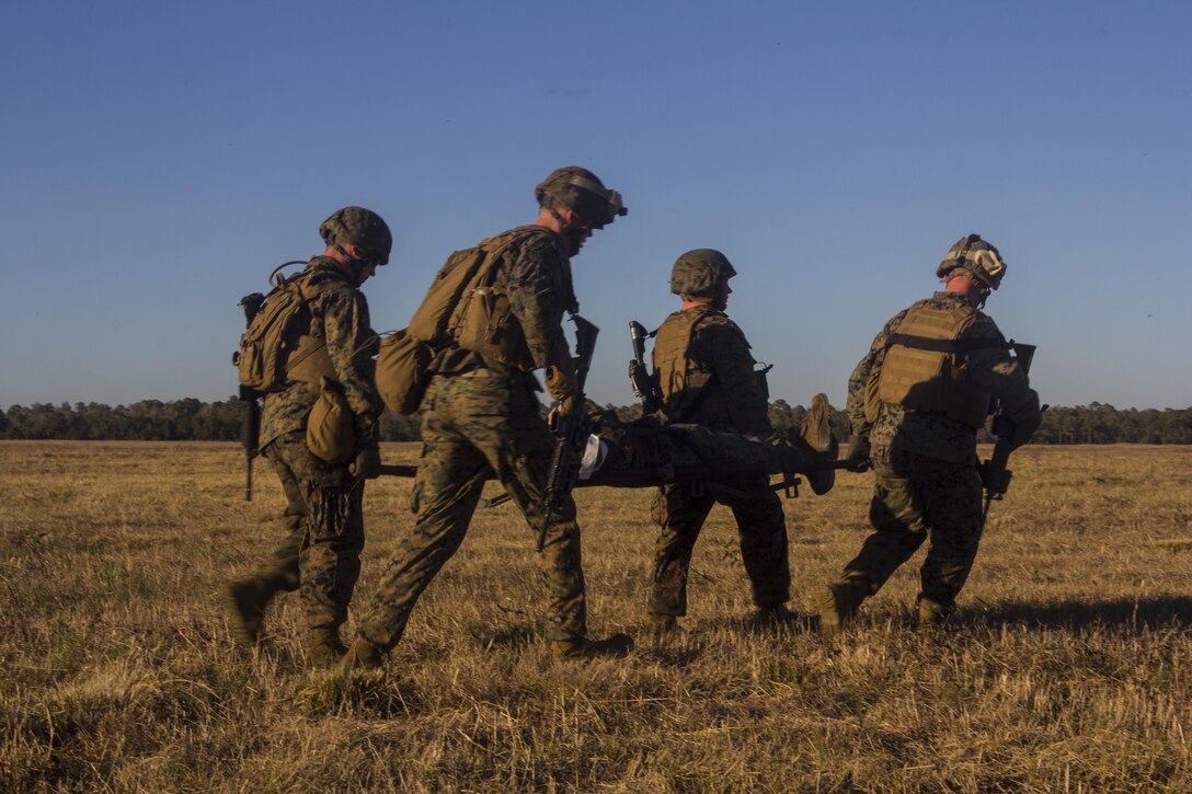 Marines and sailors of Combat Logistics Battalion (CLB) 26, 26th Marine Expeditionary Unit (MEU), carry a casualty during a mass casualty scenario during the MEU's Group Sail exercise, Camp Lejeune, N.C., Dec. 14, 2012. Group Sail consists of multiple training scenarios to include different variations of raids; visit, board, search and seizure (VBSS) training; and tactical recovery of aircraft and personnel (TRAP) simulations. The 26th MEU operates continuously across the globe, providing the president and unified combatant commanders with a forward-deployed, sea-based quick reaction force. The MEU is a Marine Air-Ground Task Force capable of conducting amphibious operations, crisis response, and limited contingency operations. The 26th MEU is slated to deploy in 2013. (Official U.S. Marine Corps photograph by Cpl. Michael Lockett)