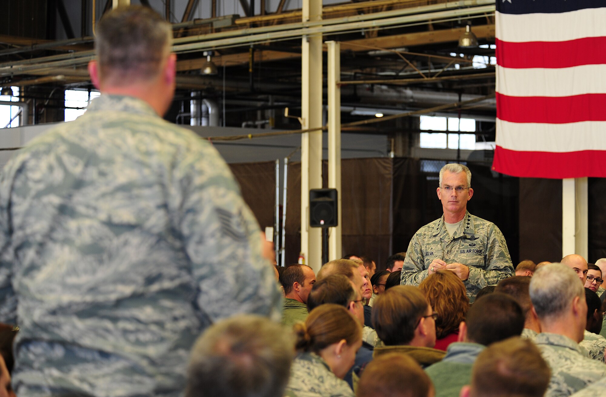 Gen. Paul Selva, the Air Mobility Command commander, answers a question from a member of Team Fairchild during an all call at Fairchild Air Force Base, Wash., Dec. 12, 2012. Fairchild Airmen asked about a variety of topics, including deployments, congressional funding and curbing suicides in the Air Force. (U.S. Air Force photo by Airman 1st Class Janelle Patino)
