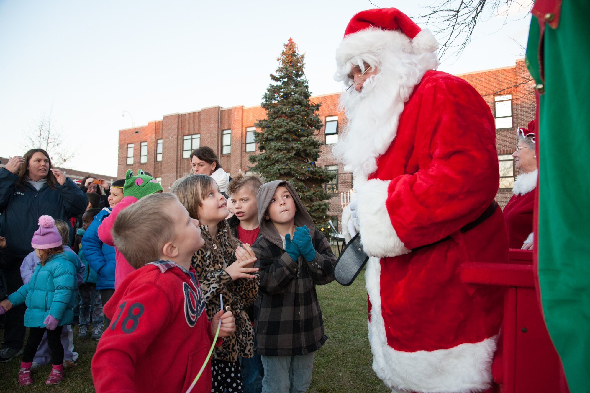 Children play at the Tree and Menorah Lighting and Holiday Card Contest Dec. 4, 2012, at Lakehurst. Santa and Mrs. Claus arrived courtesy of the JB MDL Fire Department and the 87th Security Forces Squadron following the lighting festivities. (U.S. Air Force photo by Wayne Russell/Released)