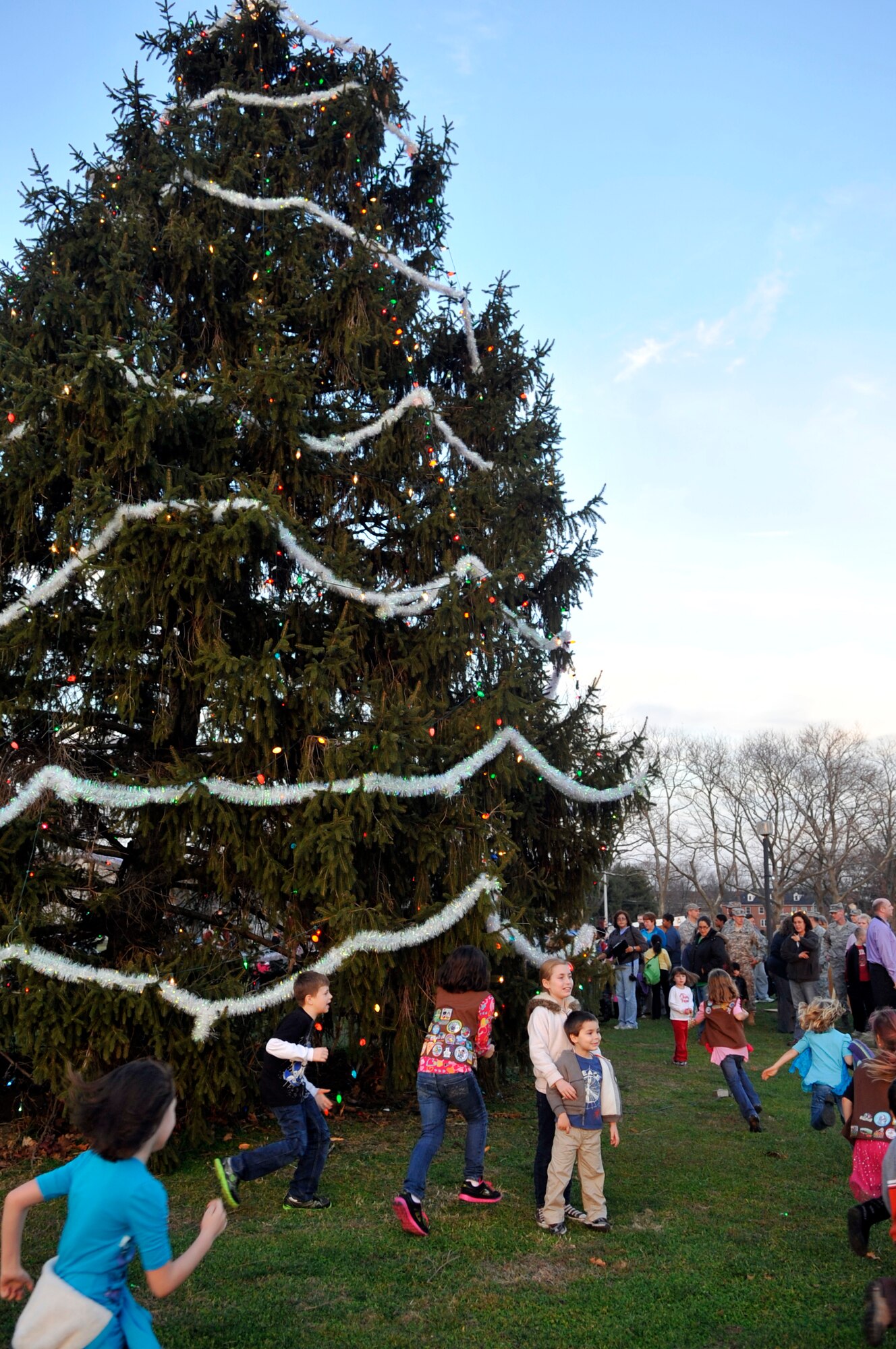 Children play at the Tree and Menorah Lighting and Holiday Card Contest Dec. 4, 2012, at Lakehurst. Santa and Mrs. Claus arrived courtesy of the JB MDL Fire Department and the 87th Security Forces Squadron following the lighting festivities. (U.S. Air Force photo by Wayne Russell/Released)