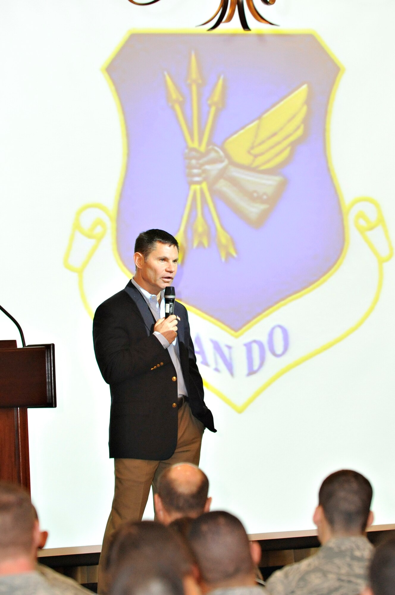 Retired Brig. Gen. Jeffrey Johnson addresses 305th Air Mobility Wing Airmen about the importance of teamwork Dec. 5, 2012, during the 305th AMW Mission Focus Day here. Johnson spoke about how his career was all about his achievements and accomplishments until he lost his wife in a tragic car accident. Friends and co-workers came to his side, realizing it’s all about teamwork. (U.S. Air Force photo by Wayne Russell/Released)