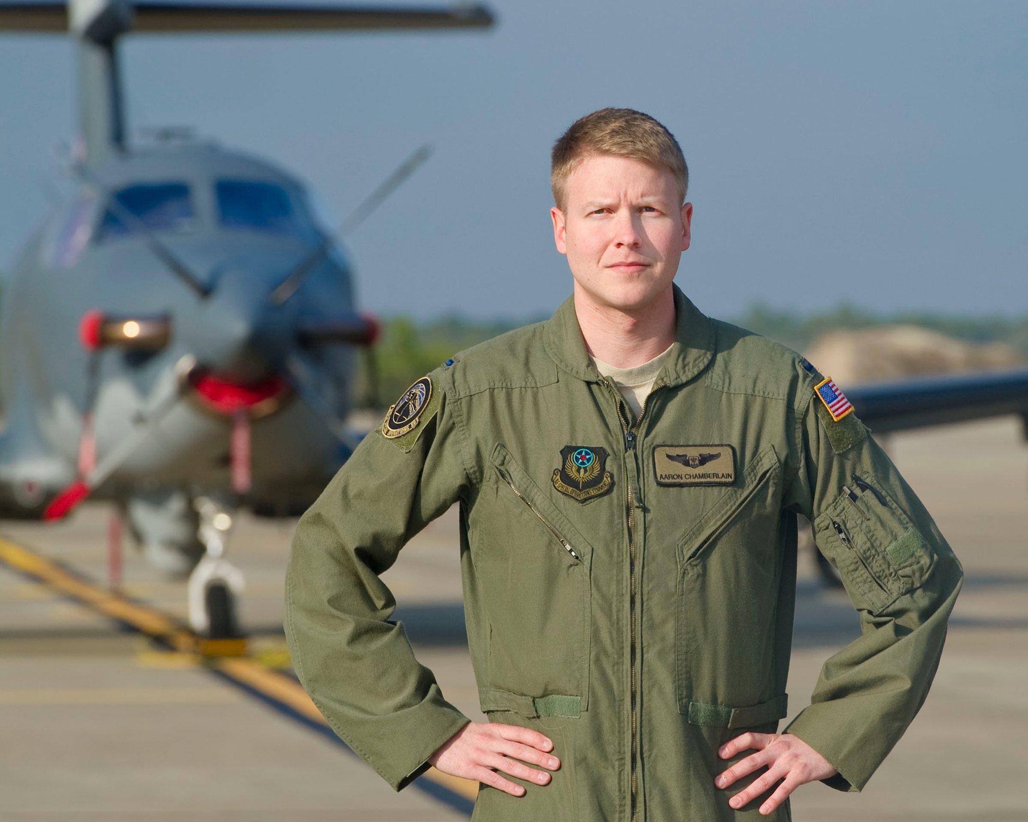 1st Lt. Aaron S. Chamberlain, a combat systems officer with the 319th Special Operations Squadron, 1st Special Operations Wing, Hurlburt Field, Fla. stands with a 319th SOS U-28 airplane on the Hurlburt Field flightline. Chamberlain recently surpassed one thousand combat hours over 190 sorties, a relatively rare occurrence for a lieutenant. (DoD photo by Tech. Sgt Vanessa Valentine) RELEASED