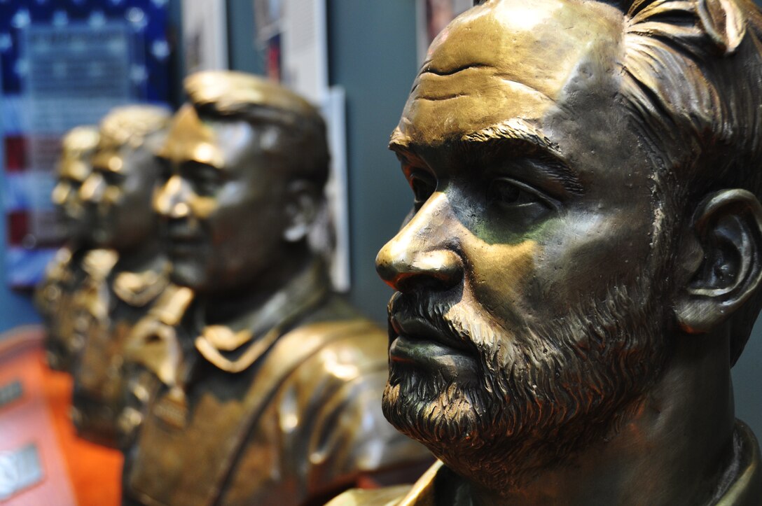 Four bronze busts in the likeness of Air Force Cross recipients were unveiled at a ceremony honoring  the Airmen  Dec. 6 at the Combat Control School at Pope Field, N.C.  These busts honor Tech. Sgt. John Chapman, Senior Airman Zach Rhyner, Staff Sgt. Robert Gutierrez, and Capt Barry Crawford.  (Air Force Photo/Major Lisa Ray)