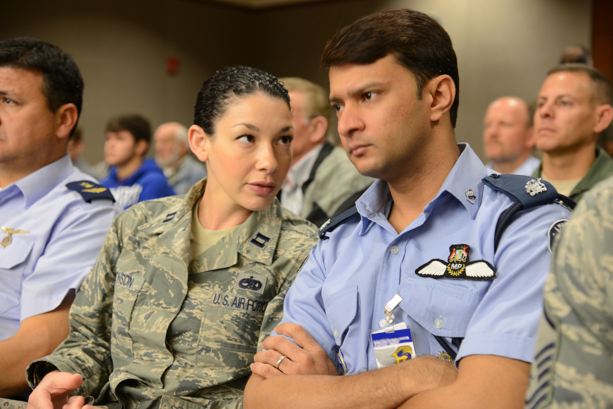 Capt. Shannon Antonson, United States Air Forces in Europe plans and requirements officer for African partnerships, talks to Maj. Sheik Ahad from Mauritius during the court observation portion of the Building Partner Aviation Capacity Course Dec. 11, 2012 in Ft. Walton Beach, Fla. By opening the course to international students, BPACC endeavors to build mutual understanding between the United States and partner nations on the unique environments and opportunities to bolster national security measures. (U.S. Air Force photo by Senior Airman Melanie Holochwost)