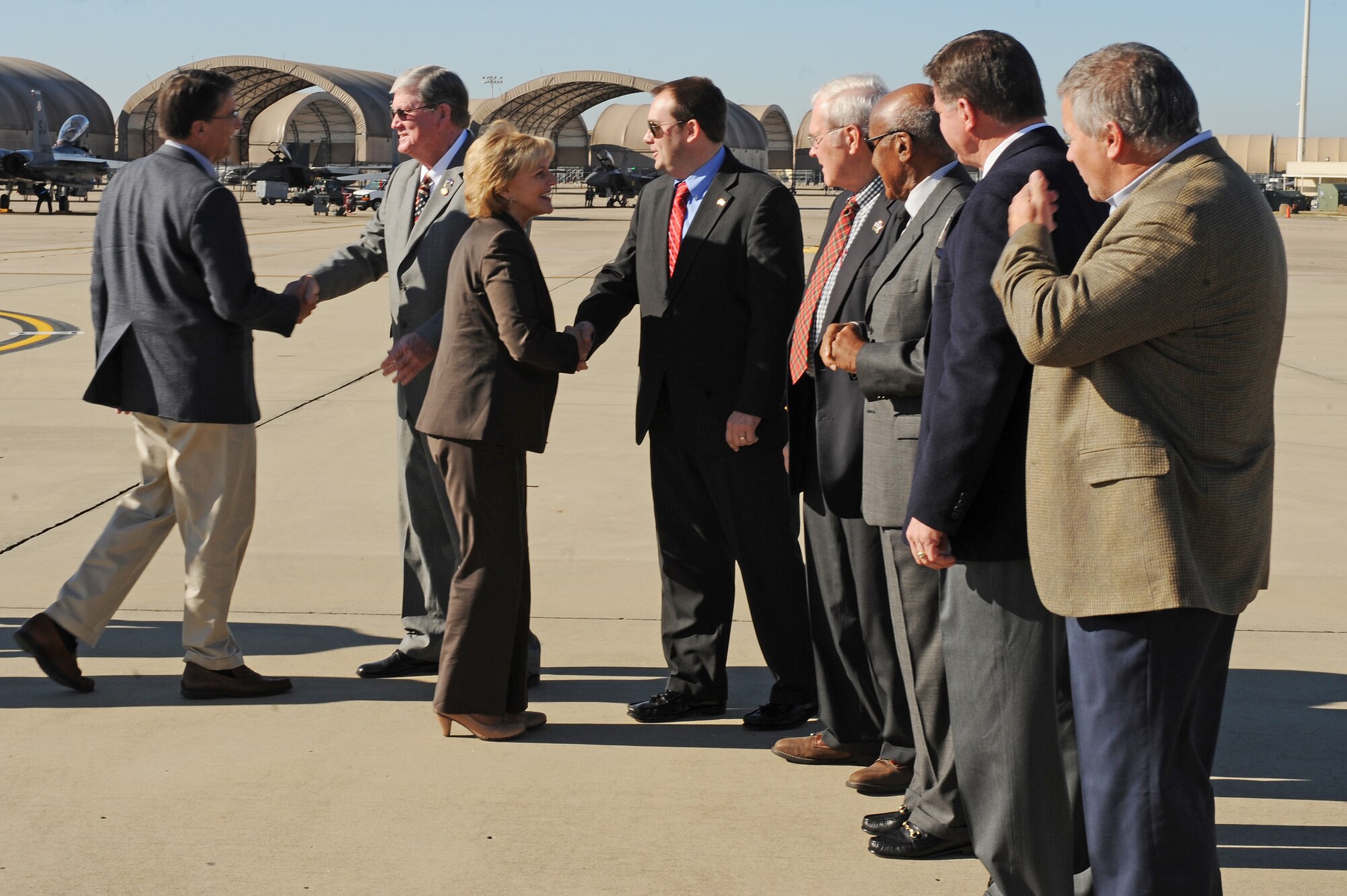 Base and community leaders greet Gov. Bev Perdue, North Carolina governor, and Governor-elect Pat McCrory, upon their arrival Seymour Johnson Air Force Base, N.C., Dec. 14, 2012. The group came together to discuss the economic impact and contributions the military has on the state. (U.S. Air Force photo/Airman 1st Class John Nieves Camacho/Released)