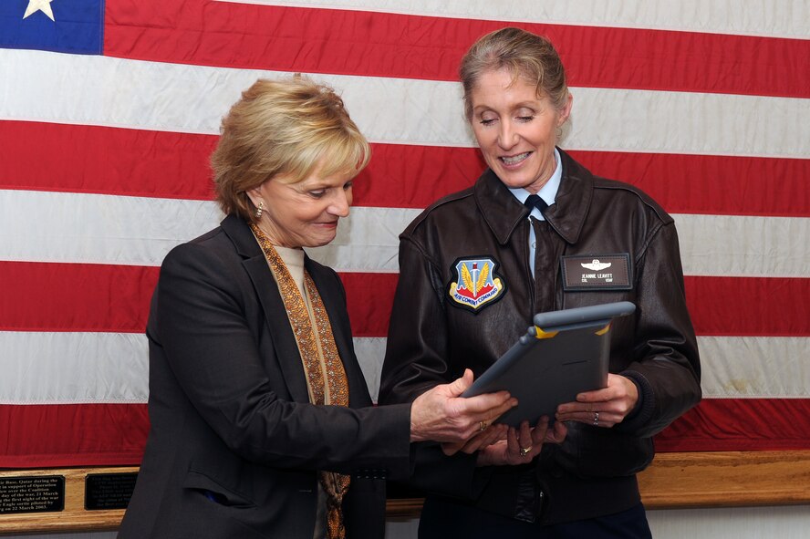 U.S. Air Force Col. Jeannie Leavitt, 4th Fighter Wing commander, presents a memento to Gov. Bev Perdue, North Carolina governor, on Seymour Johnson Air Force Base, N.C., Dec. 14, 2012. The governor and governor-elect are visiting military bases across North Carolina to continue building relationships and discuss the economic impact the military has on the state. (U.S. Air Force photo/Airman 1st Class John Nieves Camacho/Released)