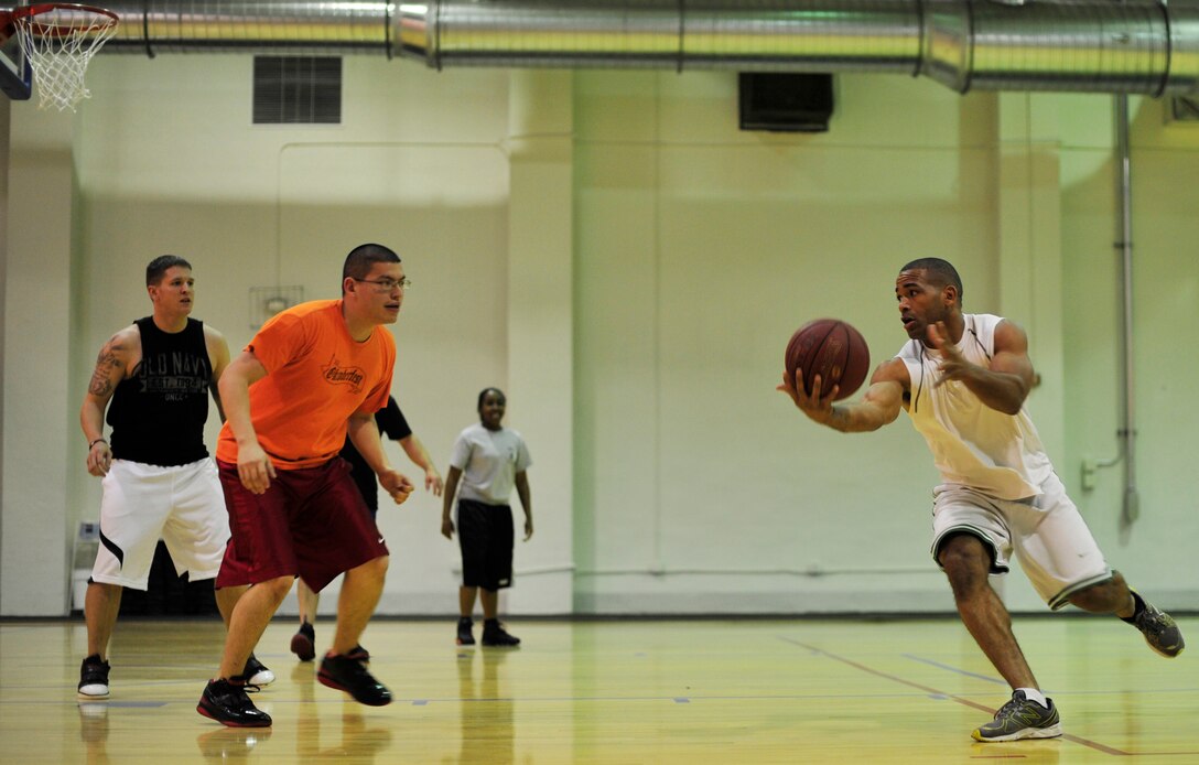 Team Andrews Service members compete in the 3-on-3 basketball tournament at the East Fitness, Dec. 7, 2012. The tournament was held as a part of “Operation Holiday Cheer,” which aimed to promote unity and teamwork between Joint Base Andrews military members. (U.S. Air Force photo/ Airman 1st Class Erin O’Shea)