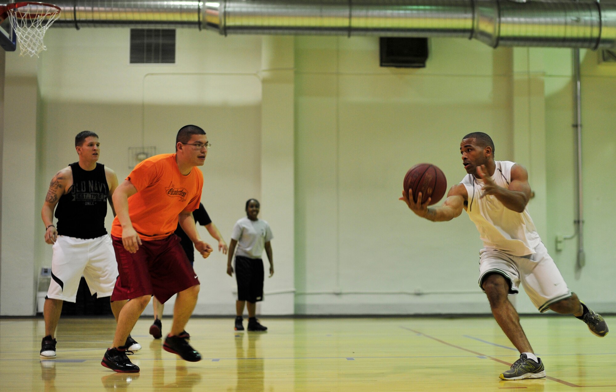 Team Andrews Service members compete in the 3-on-3 basketball tournament at the East Fitness, Dec. 7, 2012. The tournament was held as a part of “Operation Holiday Cheer,” which aimed to promote unity and teamwork between Joint Base Andrews military members. (U.S. Air Force photo/ Airman 1st Class Erin O’Shea)