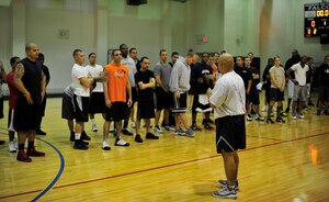 Team Andrews Service members listen to the rules of engagement prior to the 3-on-3 basketball tournament at the East Fitness Center, Dec. 7, 2012. The tournament was held as a part of “Operation Holiday Cheer,” Which aimed to promote unity and teamwork between Joint Base Andrews military members. (U.S. Air Force photo/ Airman 1st Class Erin O’Shea)