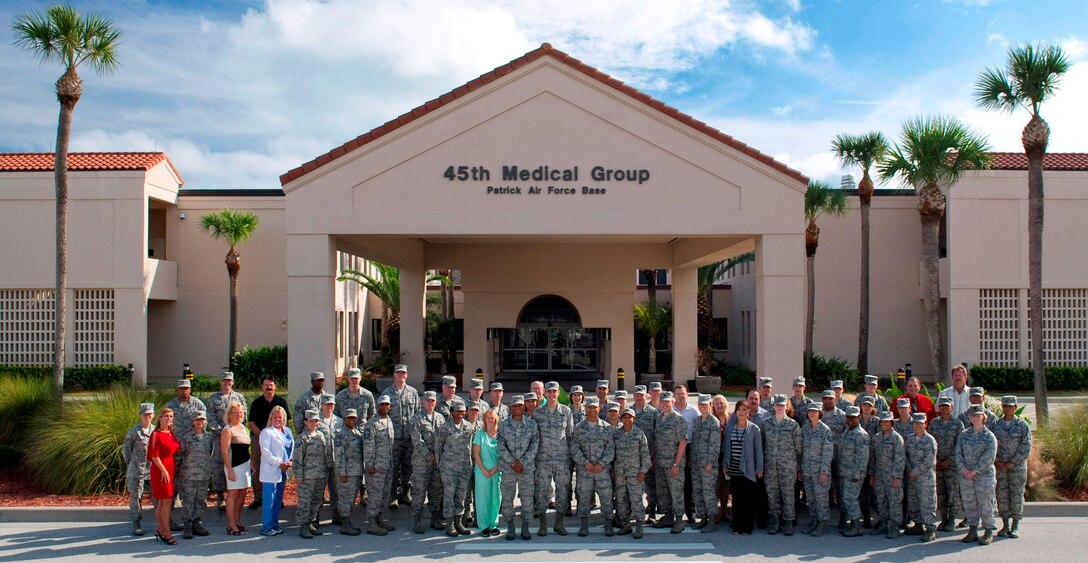 The 'Mighty Medics' of the 45th Medical Group stand proudly outside the entrance of the health clinic located on Patrick Air Force Base. 