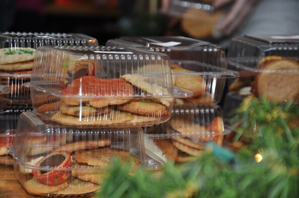 Cookies sit on a table prior to being wrapped with a homemade card during the annual Officer and Civilian Spouses Organization cookie drive on Seymour Johnson Air Force Base, N.C., Dec. 10, 2012. Cookies were donated by Airmen and off base organizations to ensure more than 550 Airmen living on base had a little piece of home. (U.S. Air Force photo/Airman 1st Class Mariah Tolbert/Released)