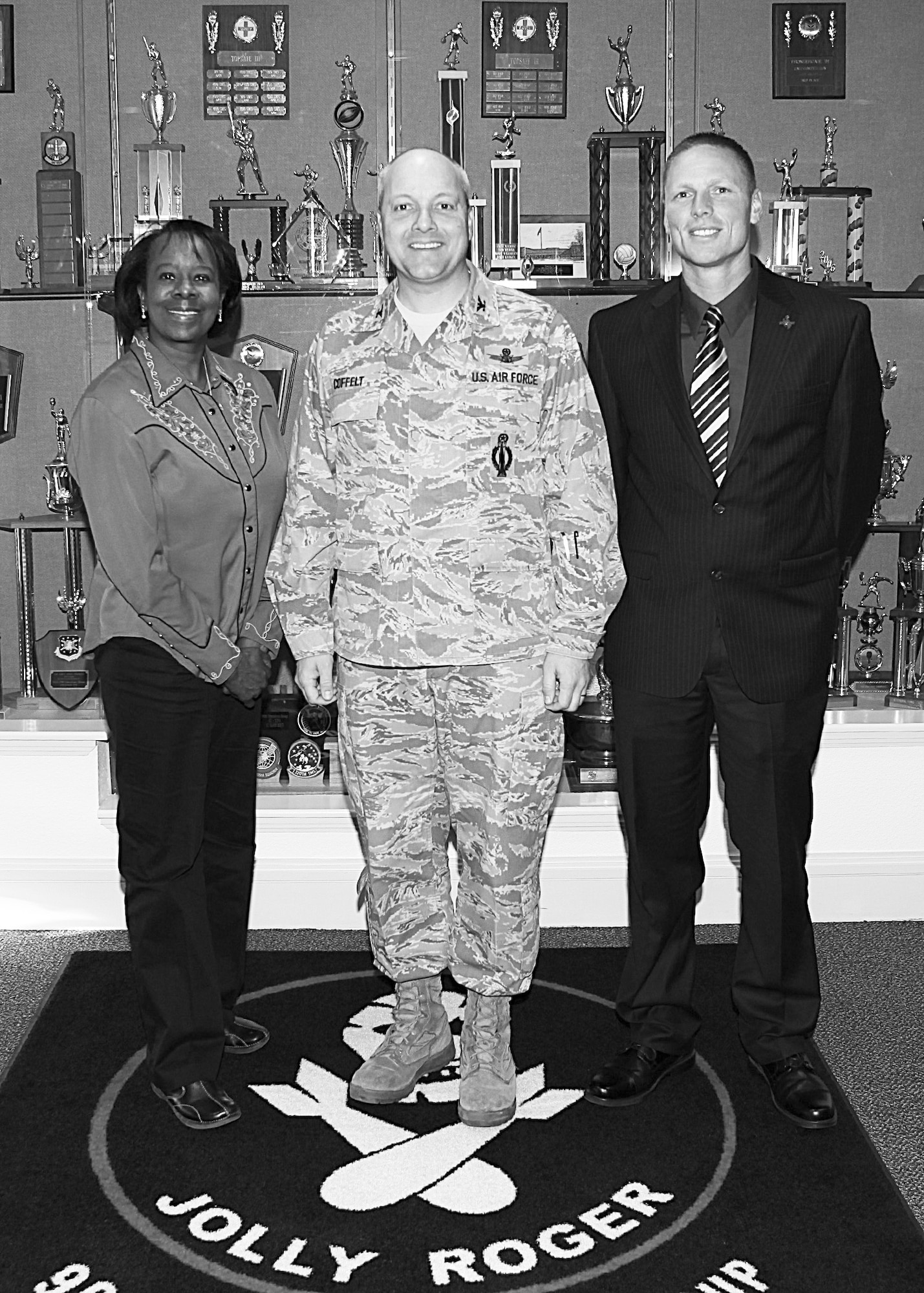 Col. Christopher Coffelt, 90th Missile Wing commander, poses for a photograph with Wyoming State Representatives Lynn Hutchings and Lee Filer during their Orientation for Community Partners visit to F. E. Warren Air Force Base Dec. 12. (U.S. Air Force photo by Matt Bilden)