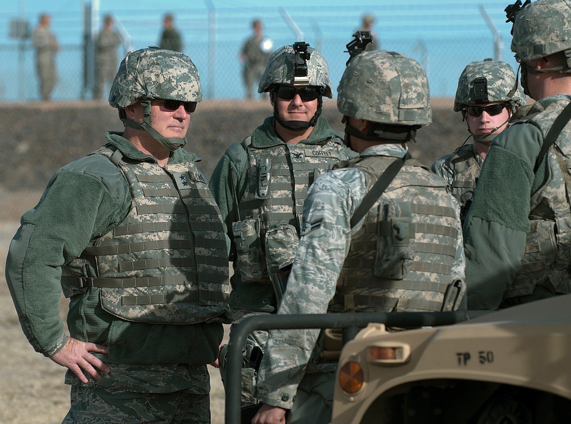 Maj. Gen. Michael Carey, 20th Air Force commander, and Col. Christopher Coffelt, 90th Missile Wing commander, receive a post brief from Airman 1st Class Andy Monticello, 790th Missile Security Forces Squadron, outside a launch facility belonging to the 319th Missile Squadron during Carey’s F. E. Warren visit Dec. 4. Carey and Coffelt embedded with a convoy out to the facility in Northern Colorado and then visited with the security and maintenance personnel on site. (U.S. Air Force photo by R.J. Oriez)
