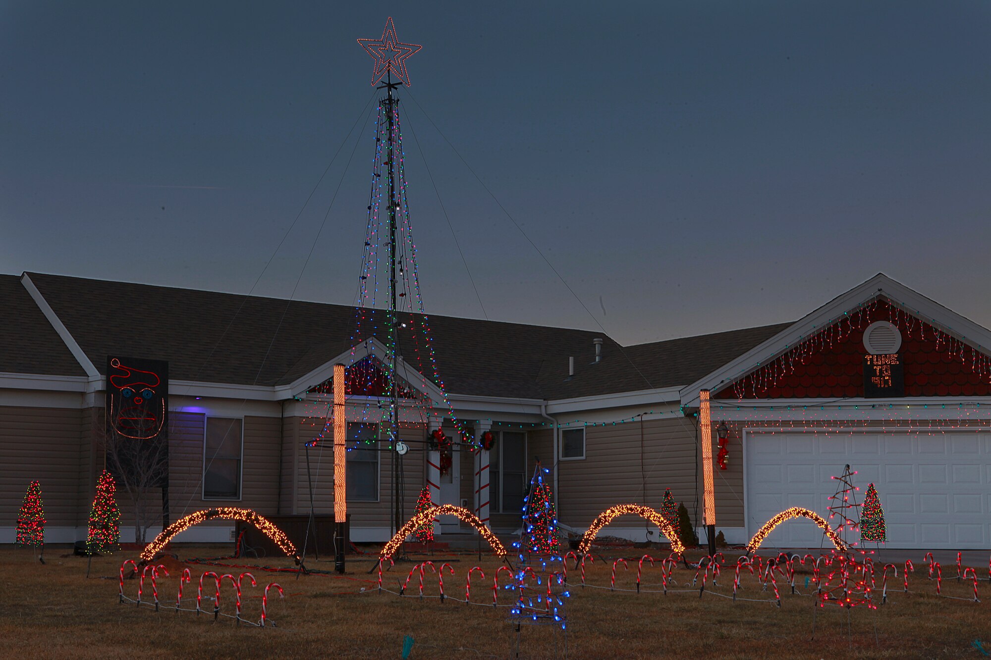 Home of Staff Sgt. Clifford Cochran, 321st Missile Squadron facility manager, decorated with Christmas lights Dec. 6. The Christmas lights are set to flash in synchronicity with music that can be heard on 91.7 FM near his home. (U.S. Air Force photo by Matt Bilden)