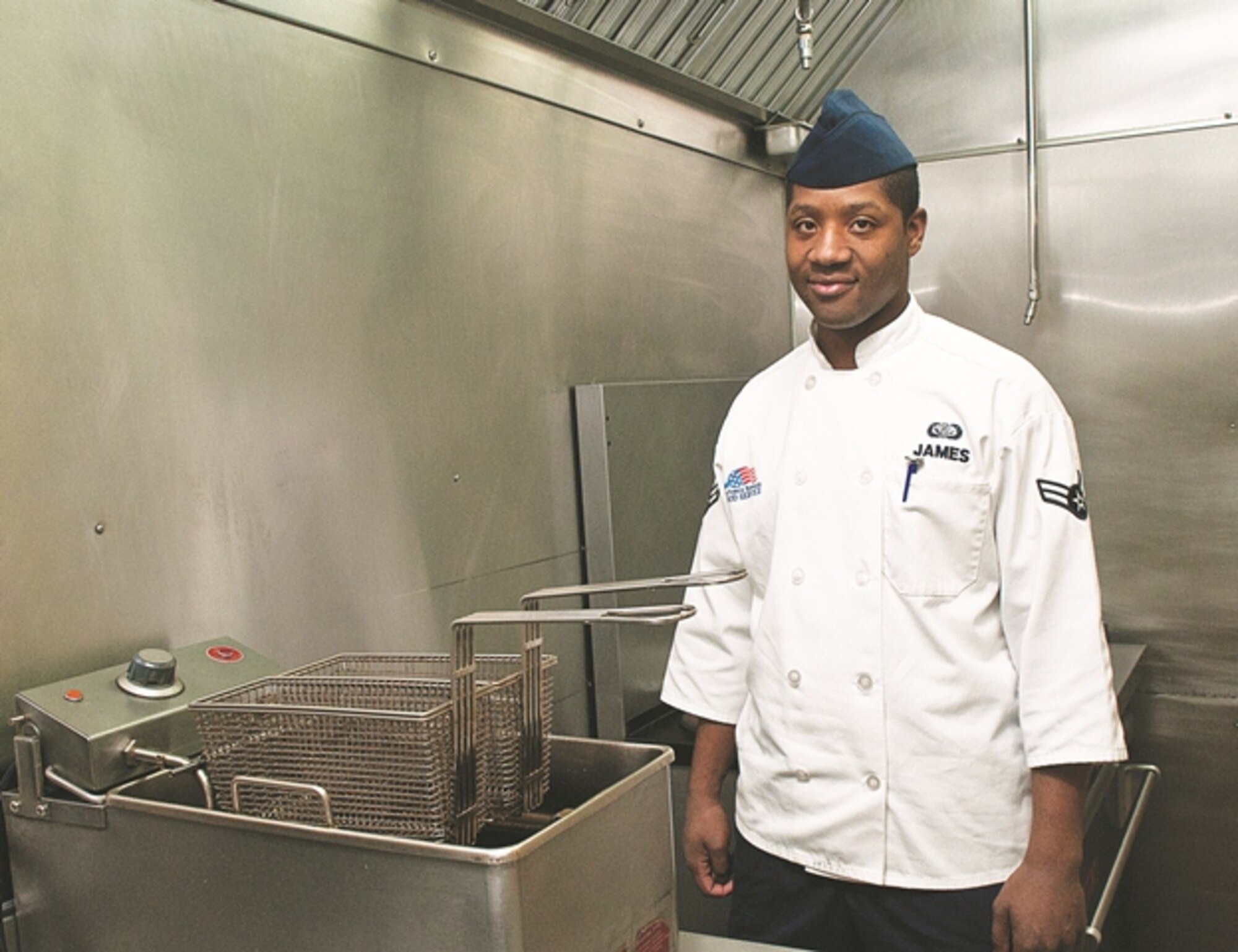 Airman 1st Class Davell James, 319th Missile Squadron chef, poses Nov. 28, in his kitchen at Missile Alert Facility Echo-1. As a MAF chef, James prepares meals for the 90th Missile Wing missile crew, security personnel and others assigned to the MAF and recently prepared food for the Chief of Staff of the Air Force and the Chief Master Sergeant of the Air Force during their recent visit to Echo-1. (U.S. Air Force photo by R.J. Oriez)