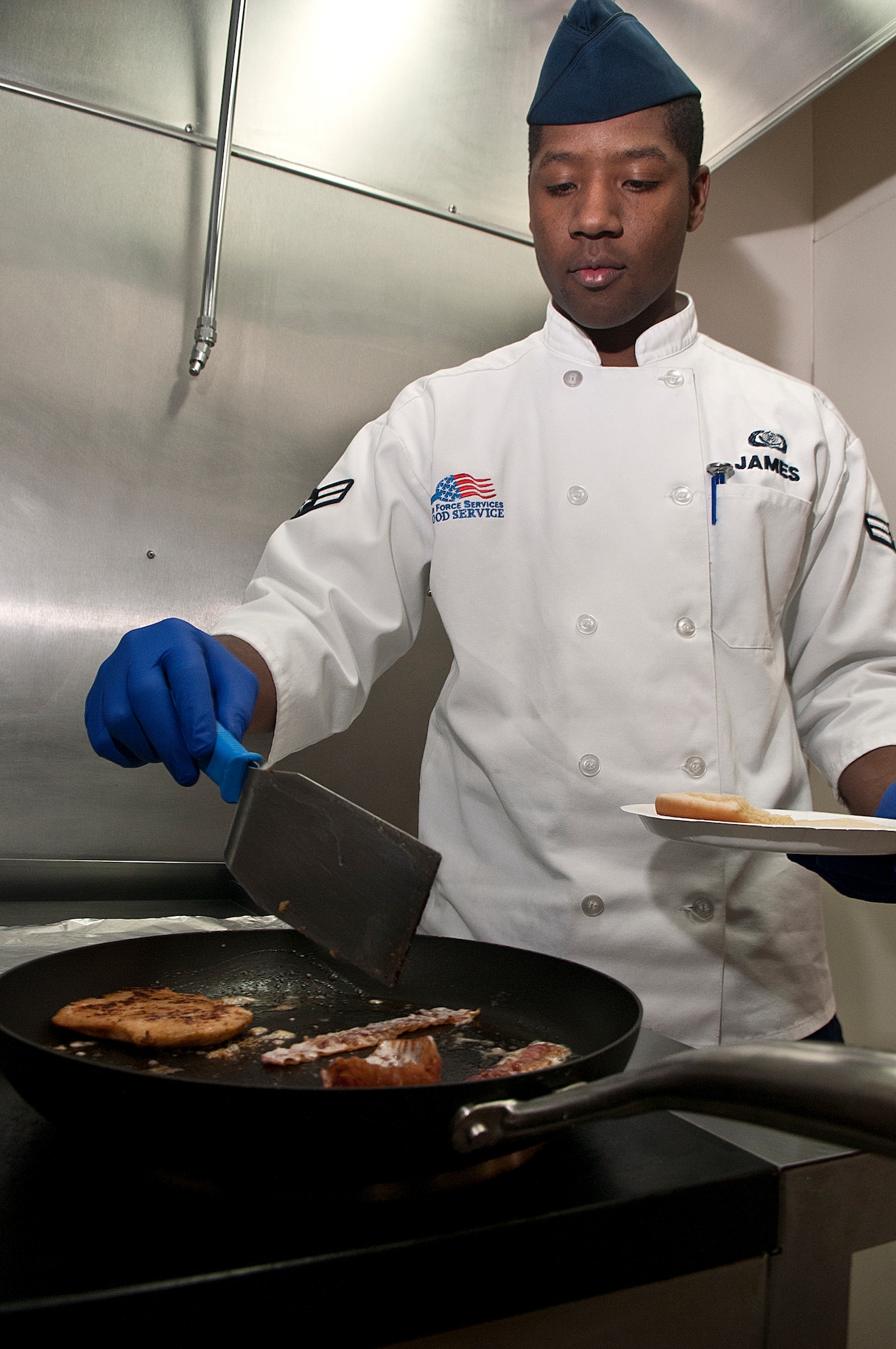 Airman 1st Class Davell James, 319th Missile Squadron chef, cooks lunch in the Missile Alert Facility Echo-1 kitchen Nov. 28. (U.S. Air Force photo by R.J. Oriez)