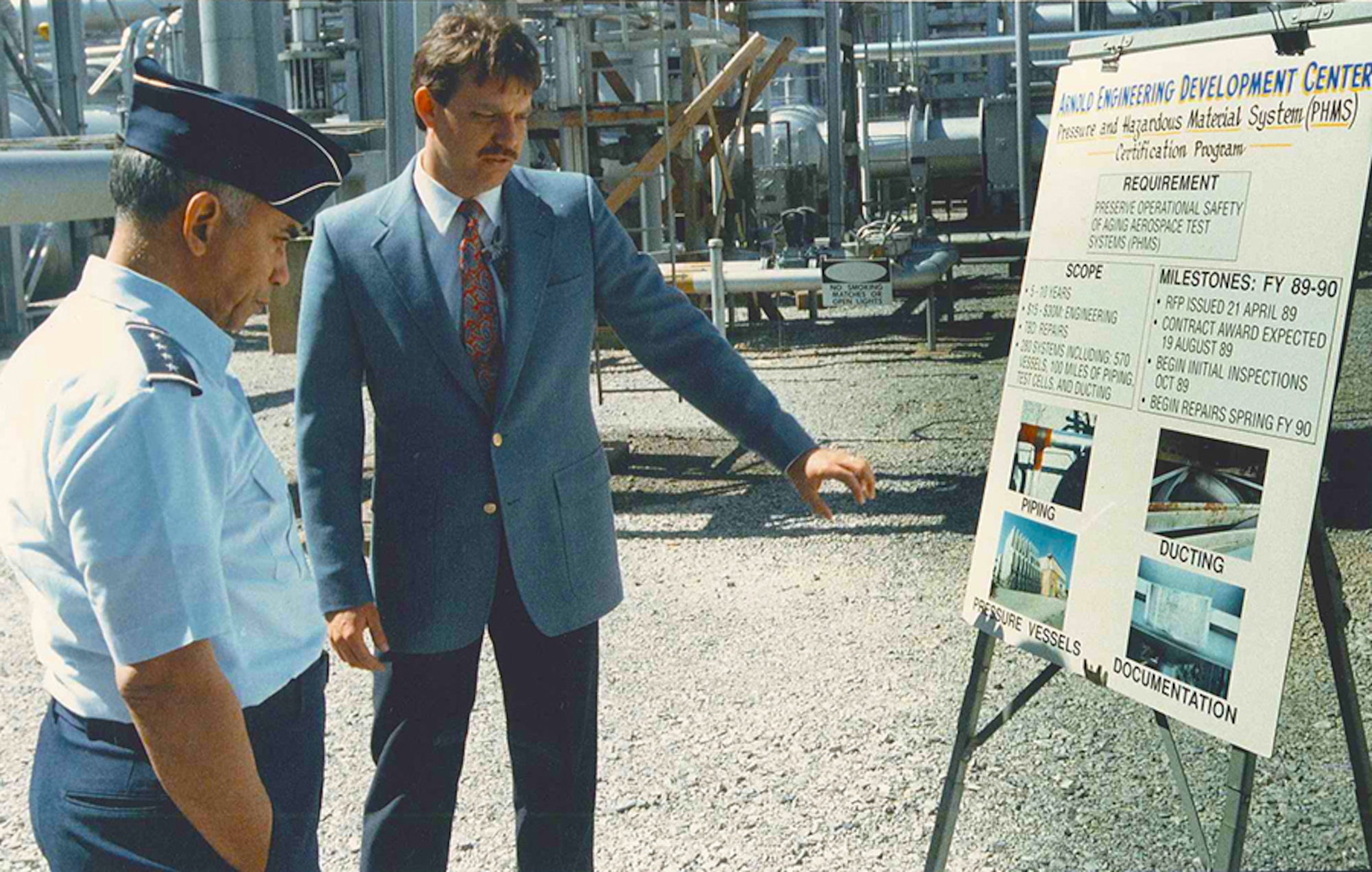 Bob Walker (right), Arnold Engineering Development Complex’s (AEDC) civil engineering branch technical director, discusses the Pressure and Hazardous Material System in 1989 to four-star General Bernard Randolph. (Photo provided by Bob Walker)