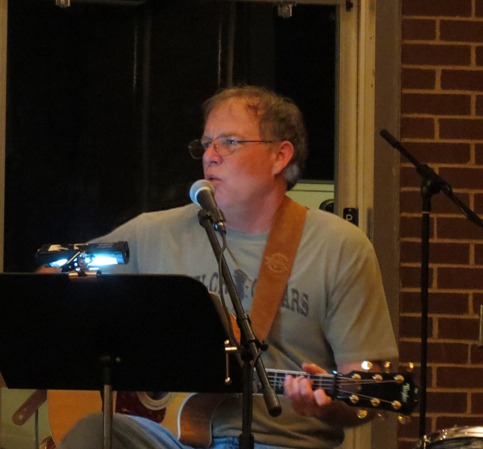Bob Walker, Arnold Engineering Development Complex’s (AEDC) civil engineering branch technical director, plays guitar with AEDC colleagues at the Arnold Lakeside Center First Friday Jam Night. (Photo provided by Bob Walker)