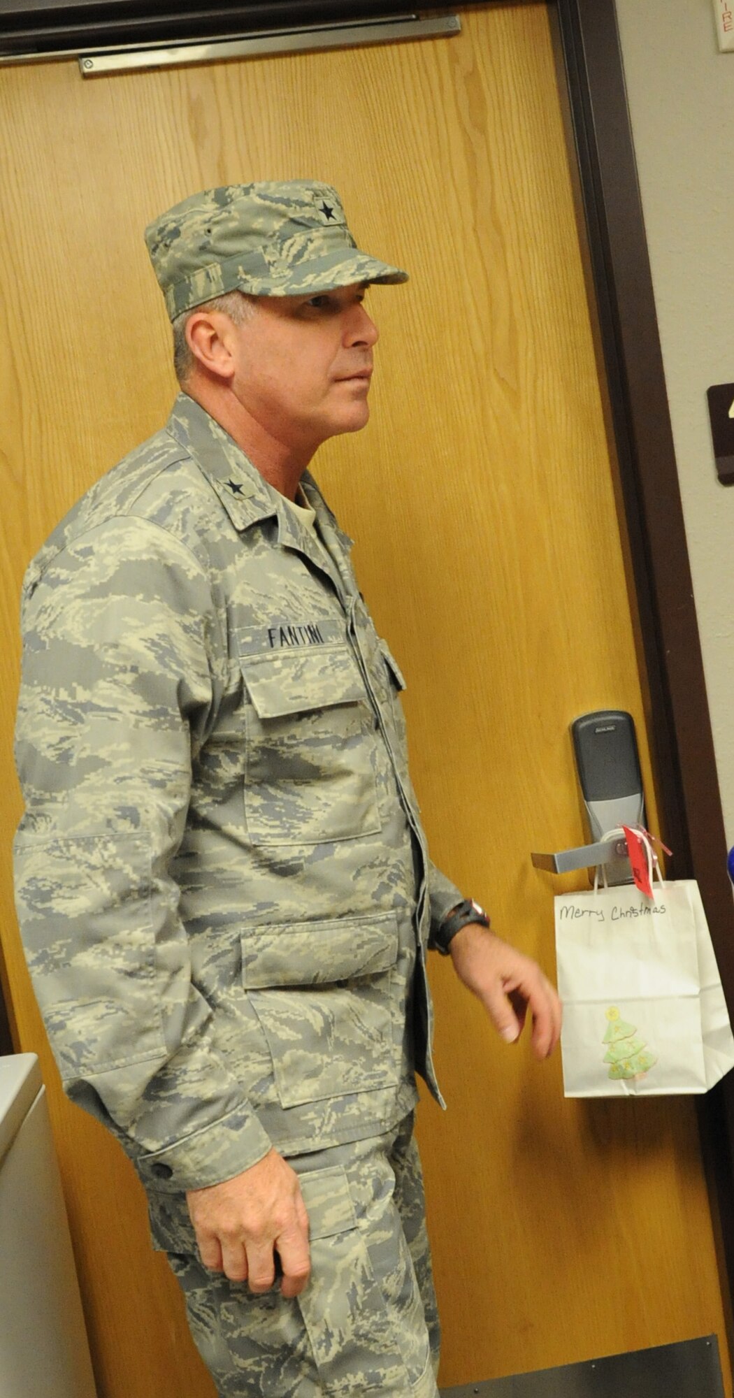 Brig. Gen. Michael Fantini helps deliver cookies to the permanent party dorm on Dec. 14 as part of the base-wide "Colossal Cookie Drive." This year about 2000 dozen cookies were distributed to Airmen-in-Training and permanent party members. (U.S. Air Force Photo/Kimberly Parker)
