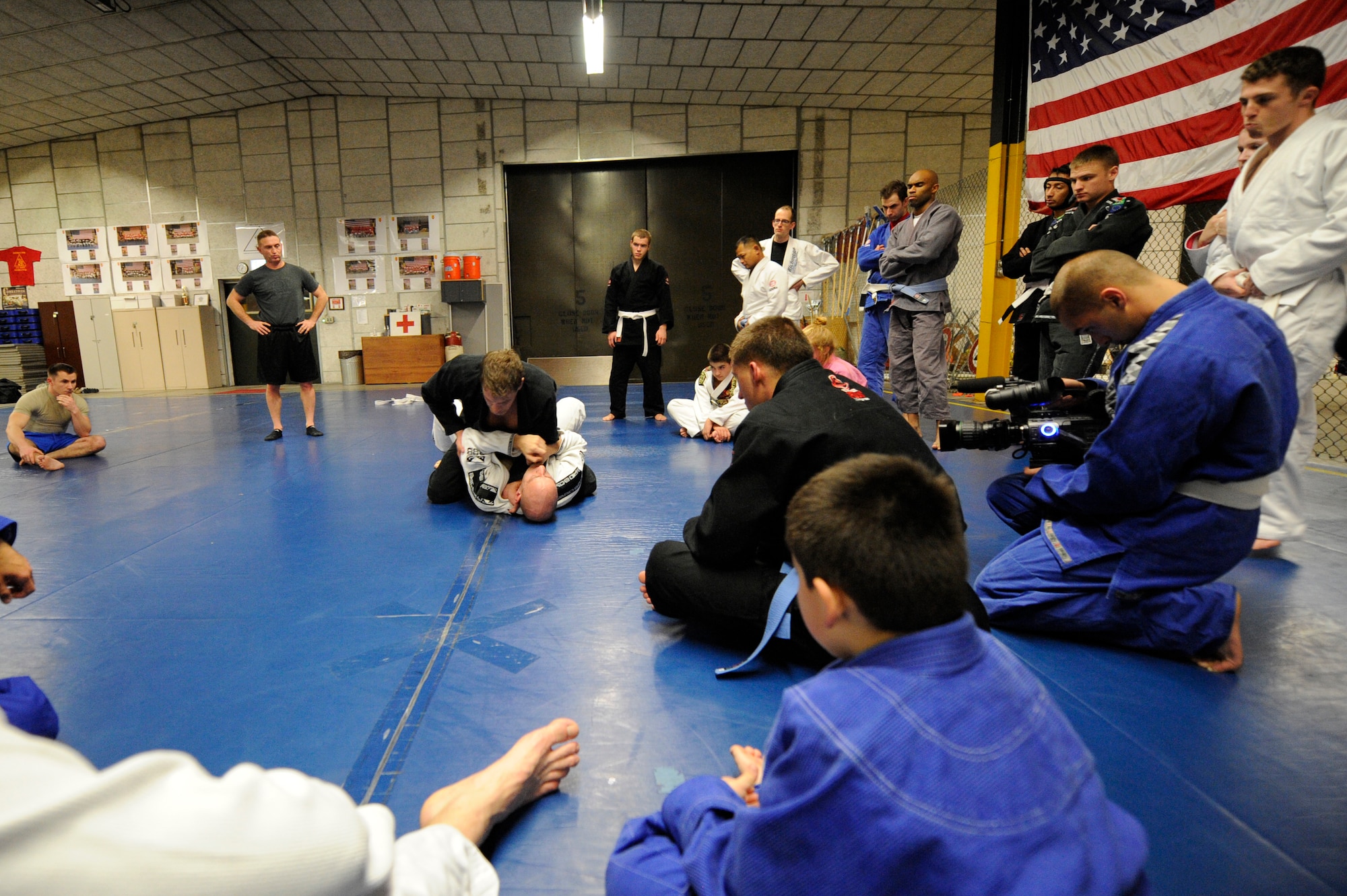Students of the Brazilian Jiu-jitsu class practice fighting techniques during a class at Rhines Ordnance Barracks, Germany, Nov. 26, 2012. Students here go over different self-defense techniques. Many different people come through the class all with different skill levels.  Some people practice Jujitsu for the technique, others for fitness or even just for self-defense. Classes are every Monday and Wednesday at 6 p.m. to 8 p.m. (U.S. Air Force photo/ Senior Airman Aaron-Forrest Wainwright) 