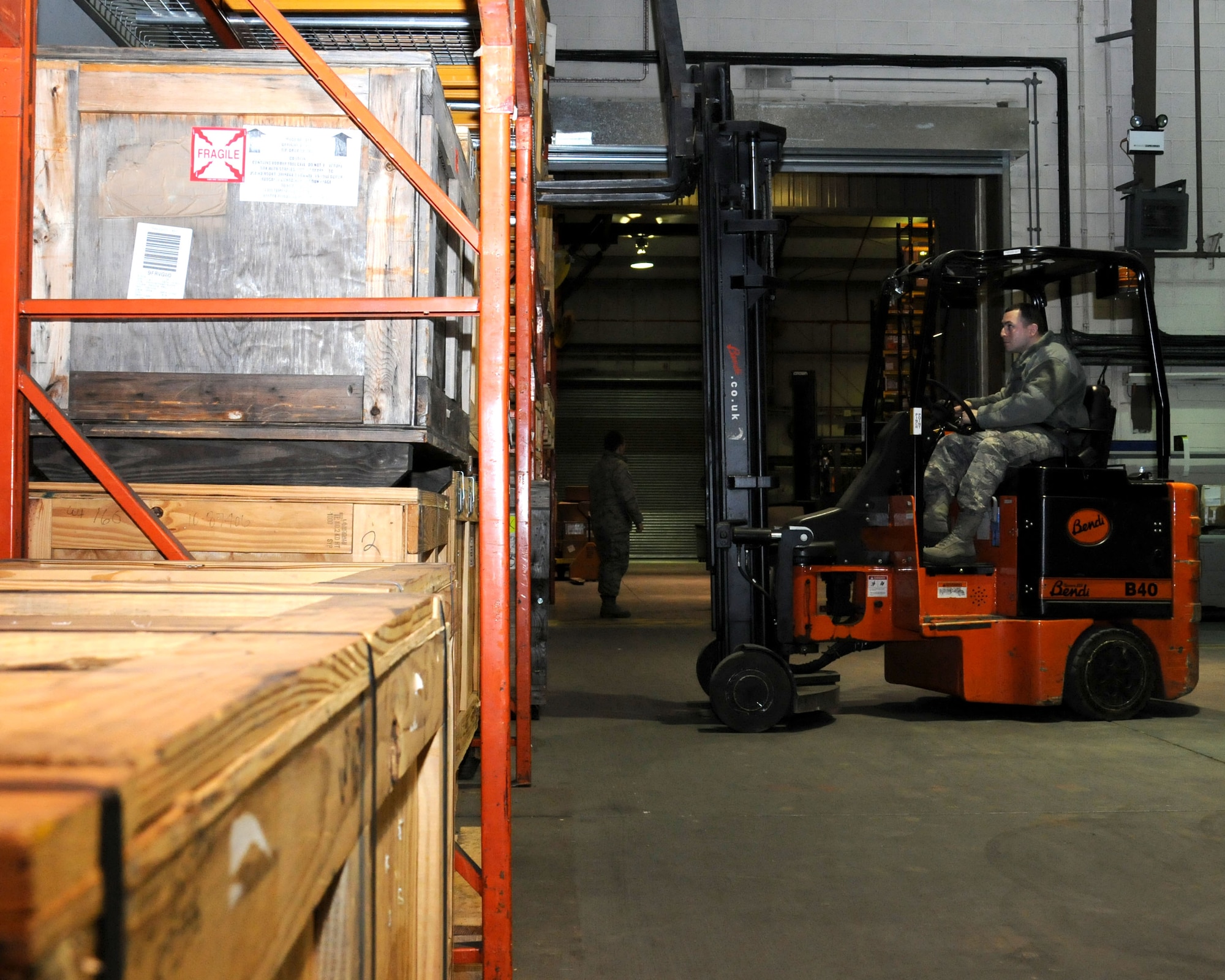 Staff Sgt. Gustavo Velez Martinez, 100th Logistics Readiness Squadron aircraft parts store supervisor, from Sabana Grande, Puerto Rico, moves crates using a forklift Dec. 14, 2012, at RAF Mildenhall, England. The aircraft parts store is the focal point for managing and distributing all aircraft parts on base. (U.S. Air Force photo by Gina Randall/Released)