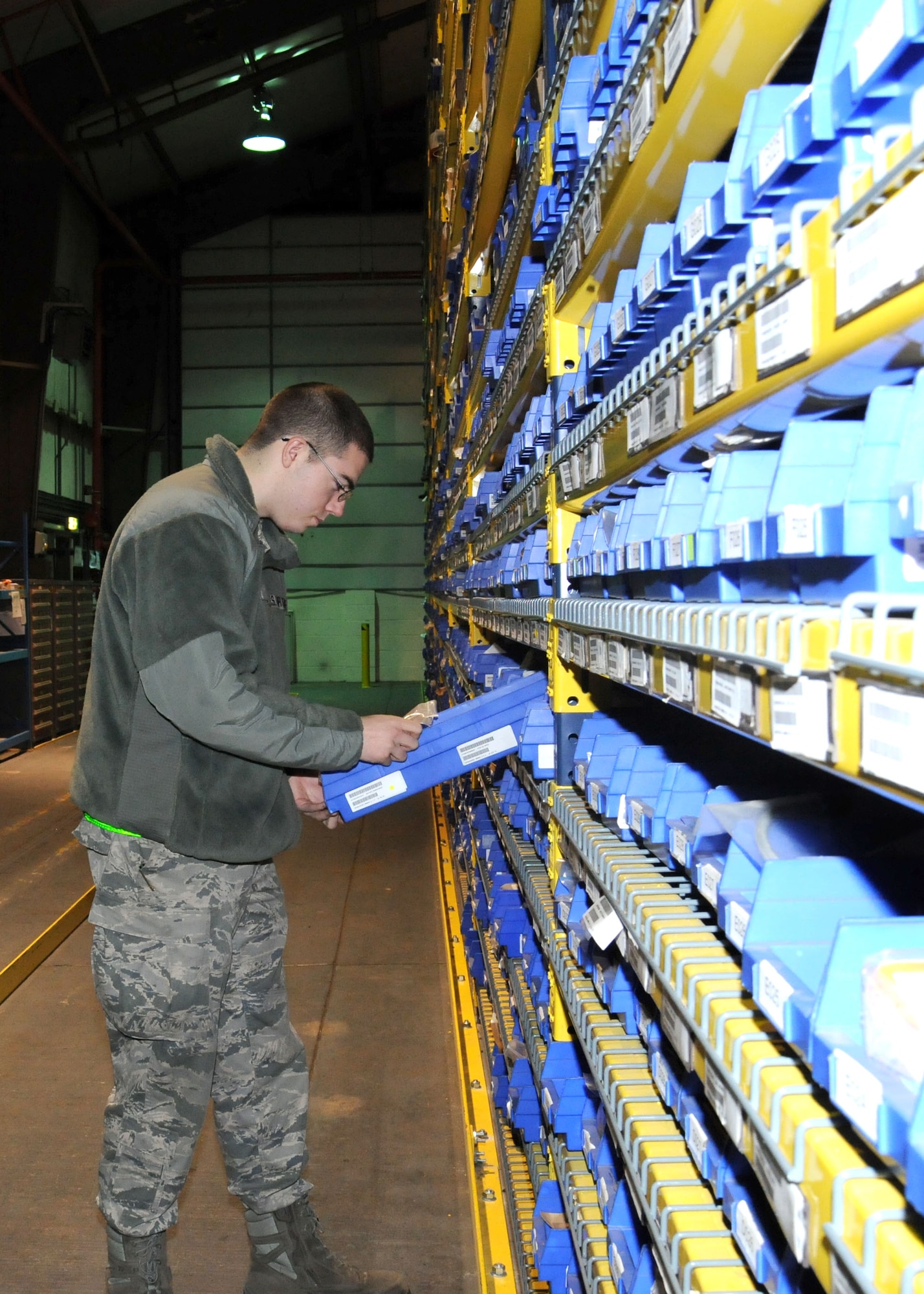 Airman 1st Class Nicholas Hall, 100th Logistics Readiness Squadron aircraft parts store technician, from Byrdstown, Tenn., conducts an inventory of assets Dec. 14, 2012, at RAF Mildenhall, England. The aircraft parts store deals with parts going to the 100th Air Refueling Wing and the 352nd Special Operations Group. (U.S. Air Force photo by Gina Randall/Released)