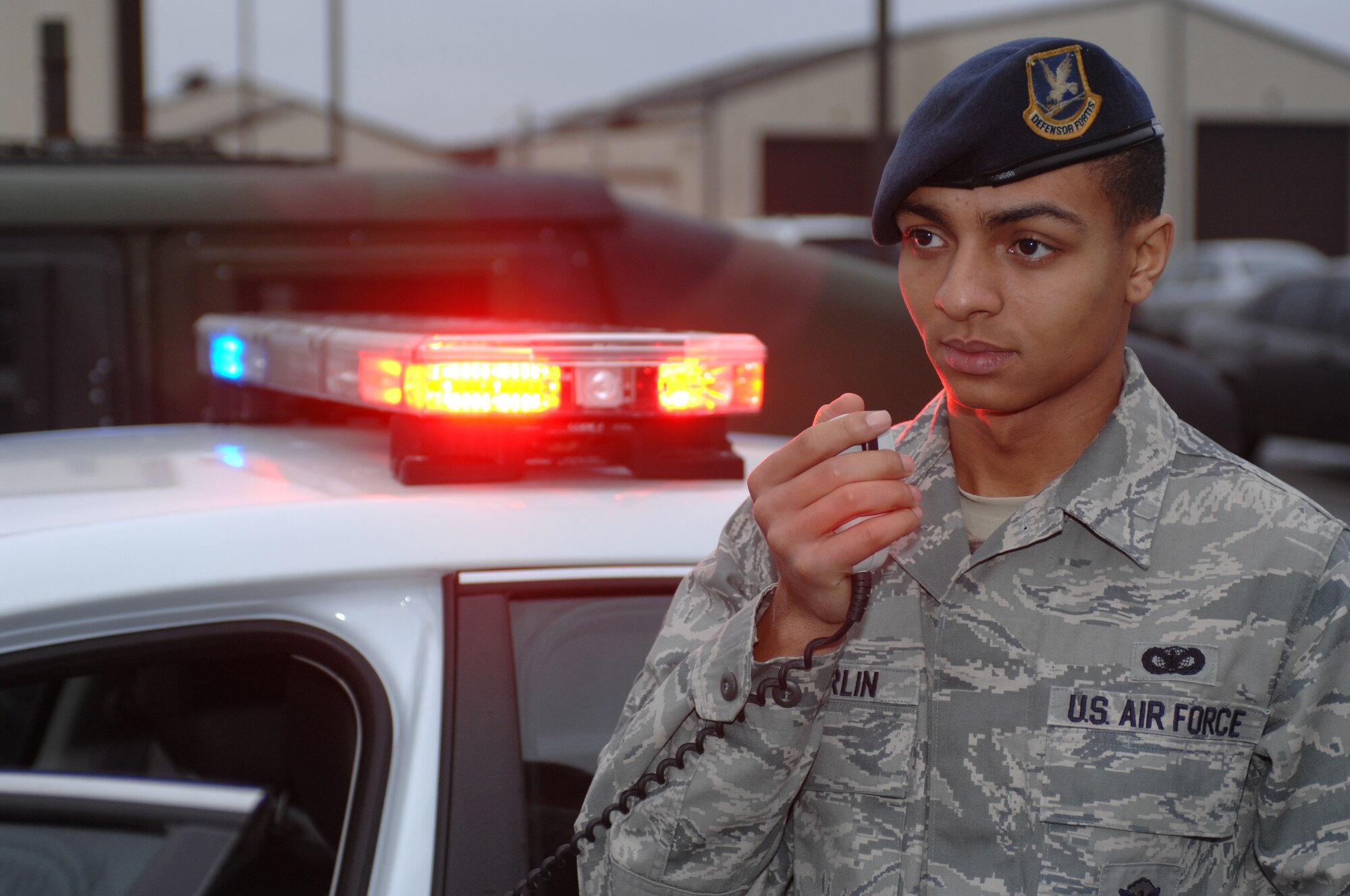 ROYAL AIR FORCE LAKENHEATH, England -- Airman 1st Class Anthony McFarlin, 48th Security Forces Squadron response force member, uses a radio to call back to dispatch Dec. 14, 2012. McFarlin was nominated for a Liberty Spotlight because he displays the core value of "Excellence in All We Do." (U.S. Air Force photo by Airman 1st Class Dana J. Butler)

