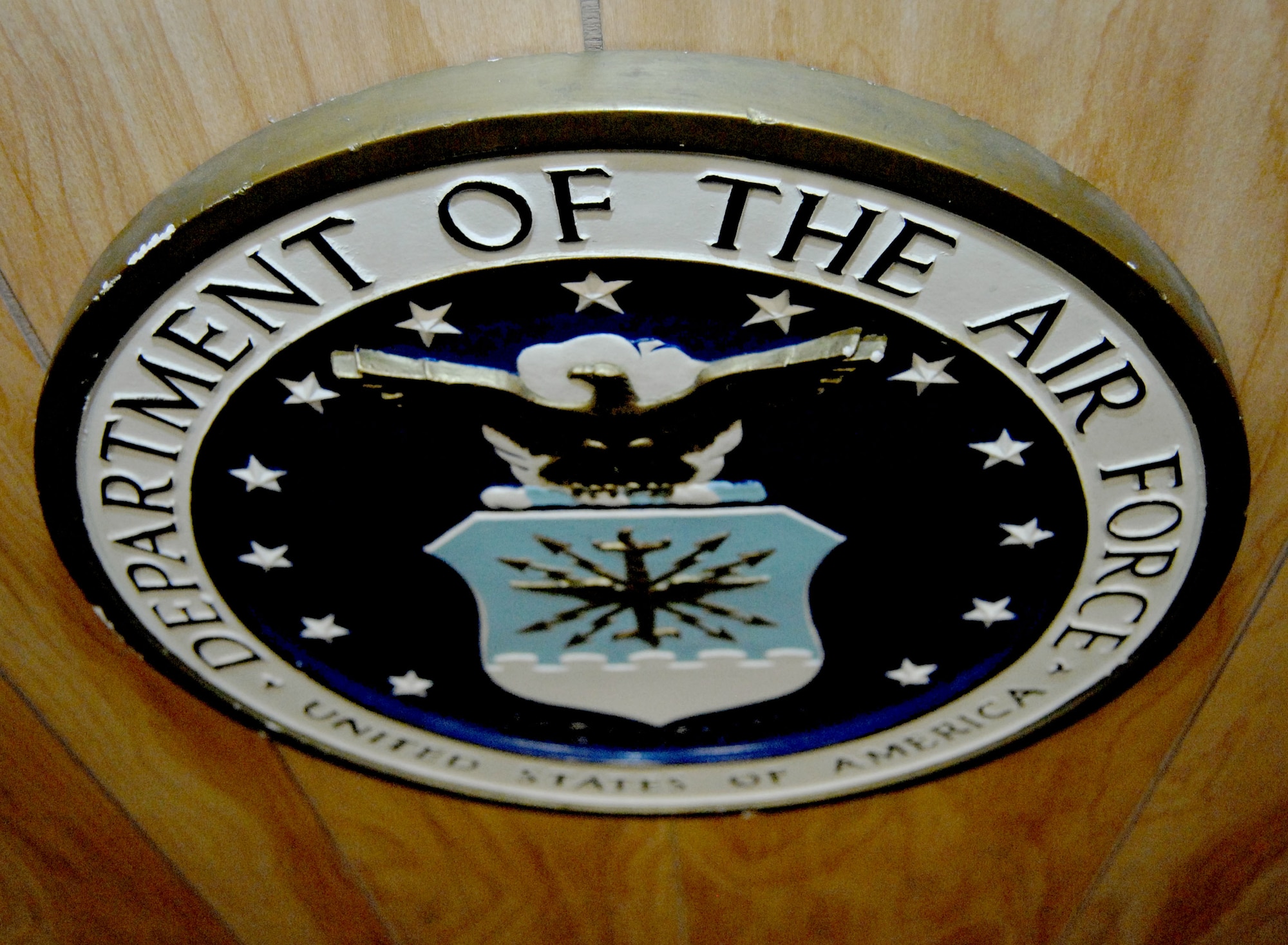 A Department of the Air Force seal serves as the focal point in an otherwise subdued courtroom at the 355th Fighter Wing Legal Office on Davis-Monthan Air Force Base, Ariz., Dec. 10, 2012. The courtroom has seen more than 30 trials during 2012. (U.S. Air Force photo by Airman 1st Class Saphfire Cook)