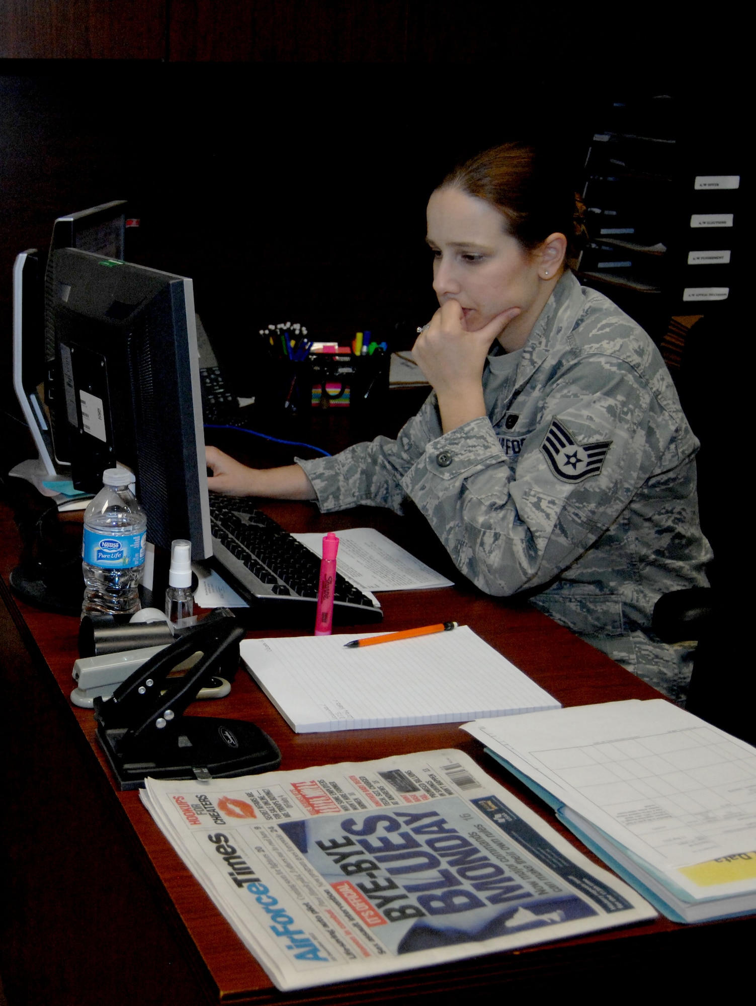 U.S. Air Force Staff Sgt. Jennifer Moore, 355th Fighter Wing Legal Office paralegal, reviews files on her computer on Davis-Monthan Air Force Base, Ariz., Dec. 10, 2012. Sergeant Moore is currently assigned to the Military Justice section of the Legal Office, which is one of the four sections that make up the 355th Fighter Wing Legal Office. (U.S. Air Force photo by Airman 1st Class Saphfire Cook)
