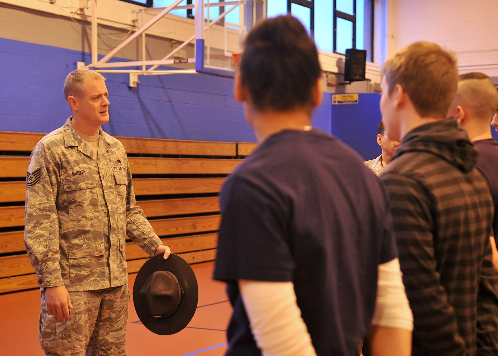 Former basic military training instructor Tech Sgt. John Suskey, 352nd Special Operations Maintenance Squadron MC-130 Electronic Warfare Systems craftsman from Hot Springs, Ark., speaks to members of the Air Force Delayed Entry Program Dec. 13, 2012, at the Northside Fitness Center at RAF Mildenhall, England. Suskey and fellow former-MTI Master Sgt. Richard Lewis spoke about the basic military training environment, including reporting statements, daily routines, and additional duties. (U.S. Air Force photo by Senior Airman Jerilyn Quintanilla/Released)