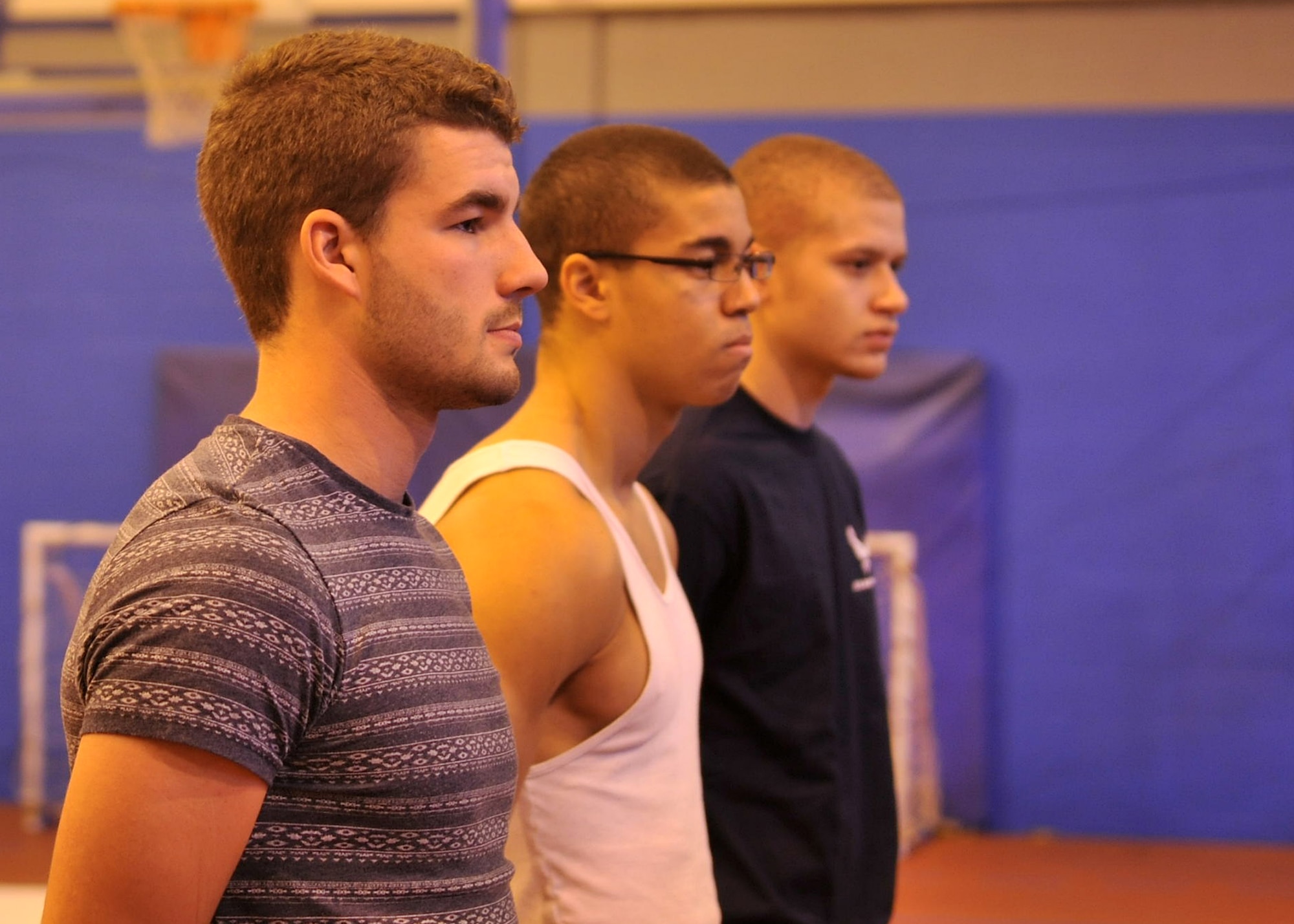 Members of the Air Force Delayed Entry Program stand in formation Dec. 13, 2012, at the Northside Fitness Center at RAF Mildenhall, England. The base recruiters hosted a meeting for DEP members aimed to give them a glimpse into the basic military training environment. (U.S. Air Force photo by Senior Airman Jerilyn Quintanilla/Released)