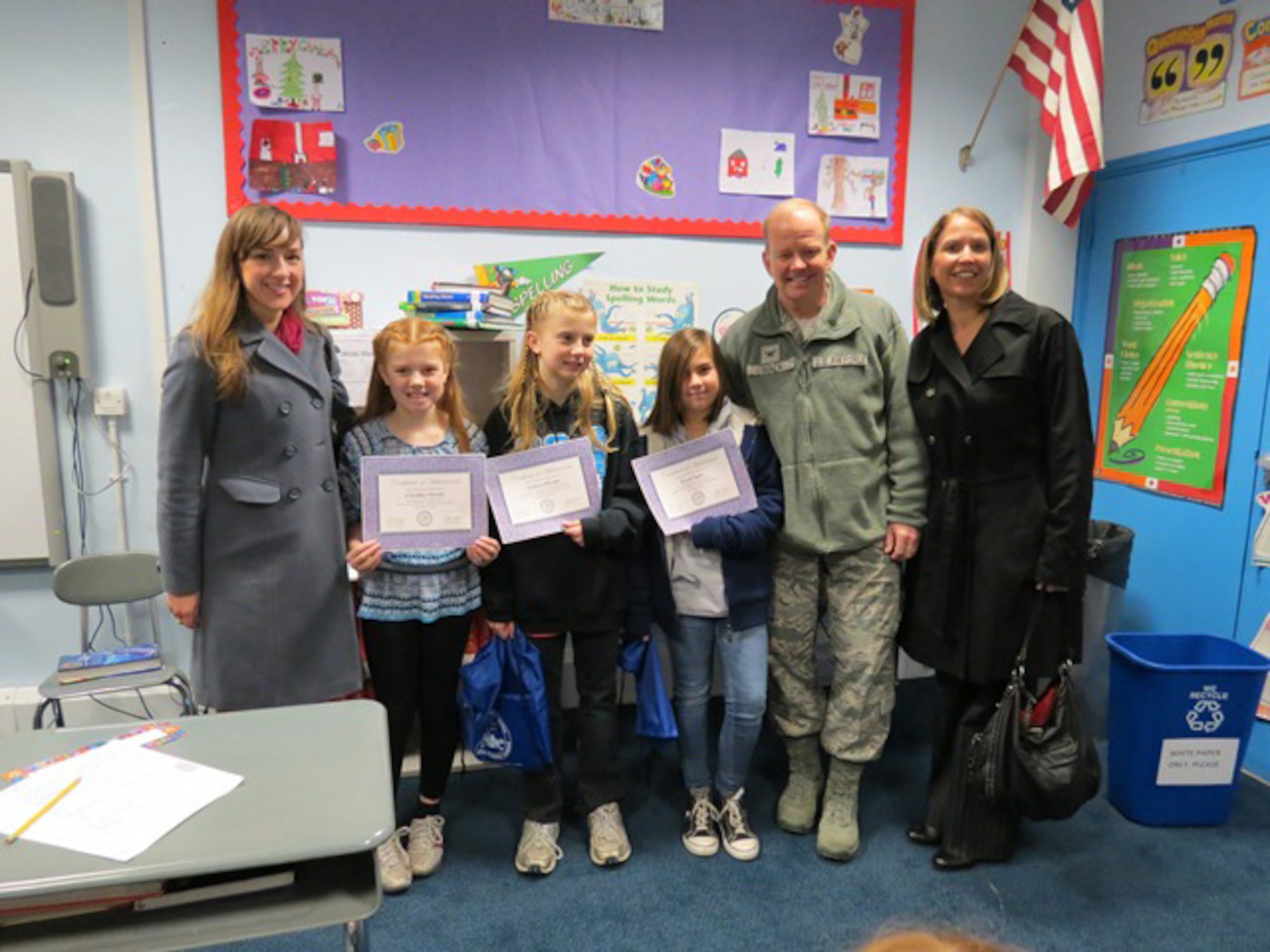 ROYAL AIR FORCE LAKENHEATH, England - Liberty Intermediate School fourth and fifth grade essay contest winners pose for a photo with Col. Scott Benza, 48th Mission Support Group commander, and members of the RAF Lakenheath/Mildenhall School Liaison Office. (Courtesy Photo)