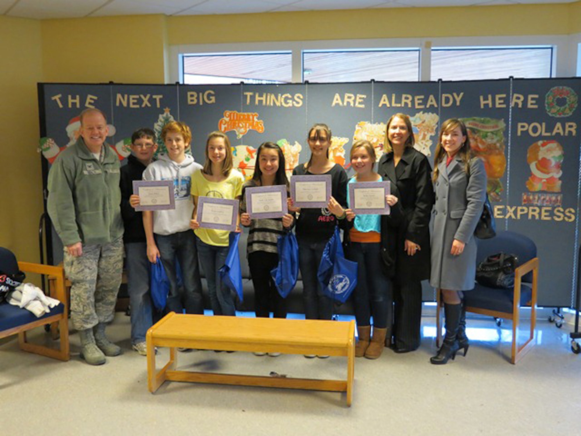 ROYAL AIR FORCE LAKENHEATH, England - Lakenheath Middle School sixth through eighth grade essay contest winners pose for a photo with Col. Scott Benza, 48th Mission Support Group commander, and members of the RAF Lakenheath/Mildenhall School Liaison Office. (Courtesy Photo)