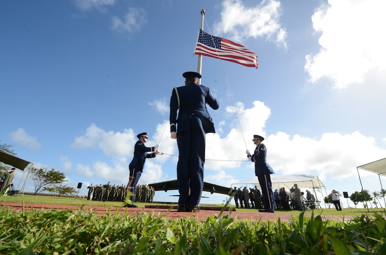 The Andersen Air Force Base honor guard lowers the flag to half-staff during the Operation Linebacker II Remembrance Ceremony at Andersen Air Force Base, Guam, Dec. 14, 2012. The ceremony commemorated the 40th anniversary of the Linebacker II campaign that led to the end of the Vietnam War. (U.S. Air Force photo by Senior Airman Benjamin Wiseman/Released)