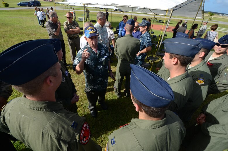 Senior Master Sgt. (ret.) Gary “Boomer” Adams speaks with B-52 crewmembers after the Operation Linebacker II Remembrance Ceremony at Andersen Air Force Base, Guam, Dec. 14, 2012. Boomer was an aerial refueling boom operator during Operation Linebacker II and placed the wreath during the ceremony to honor the Airmen that were lost during the operations. (U.S. Air Force photo by Senior Airman Benjamin Wiseman/Released)