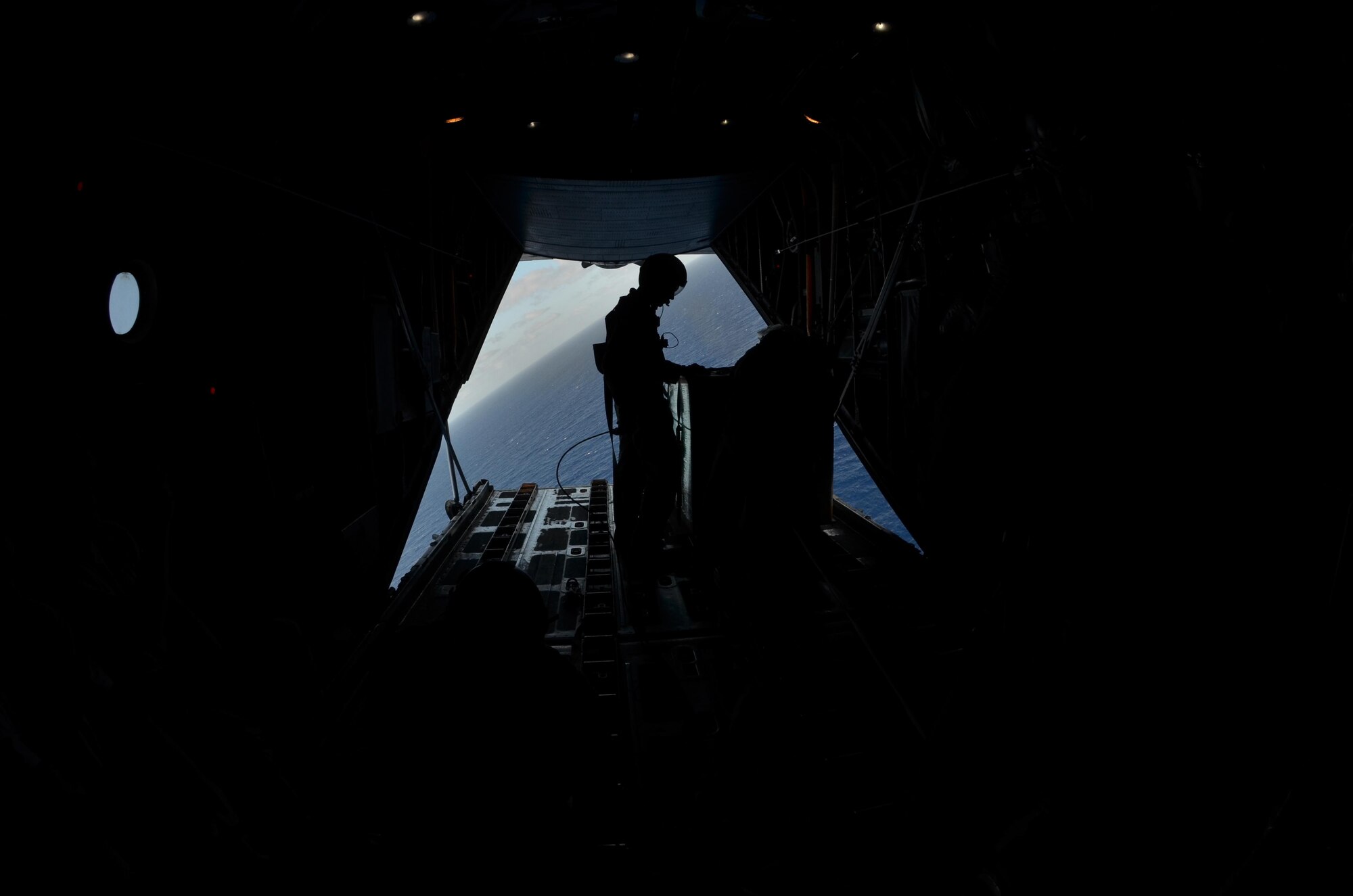 Staff Sgt. Nick Alarcon, 36th Airlift Squadron instructor loadmaster, inspects the last box of humanitarian assistance goods prior to its airdrop during an Operation Christmas Drop flight from Andersen Air Force Base, Guam, Dec. 14, 2012. Each year OCD provides aid to more than 30,000 islanders in Chuuk, Palau, Yap, Marshall Islands and Commonwealth of the Northern Mariana Islands. This year is the 61st anniversary of OCD, making it the longest running humanitarian mission in the world. In total, there are eight planned days of air drops, with 54 islands scheduled to receive humanitarian aid. (U.S. Air Force photo/Staff Sgt. Alexandre Montes/Released)