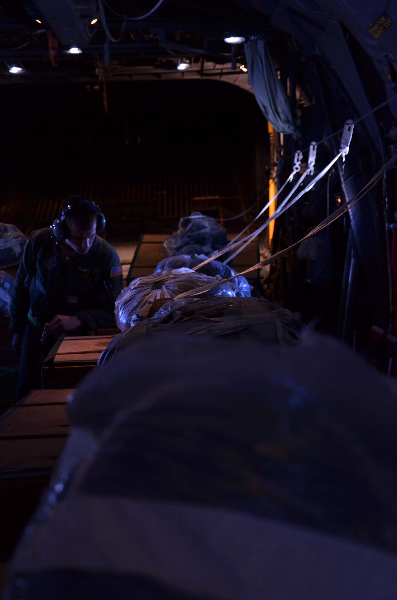 Senior Airman Timothy Oberman, 36th Airlift Squadron loadmaster, inspects each pallet for their Operation Christmas Drop delivery from Andersen Air Force Base, Guam, Dec. 14, 2012. Each year OCD provides aid to more than 30,000 islanders in Chuuk, Palau, Yap, Marshall Islands and Commonwealth of the Northern Mariana Islands. This year is the 61st anniversary of OCD, making it the longest running humanitarian mission in the world. In total, there are eight planned days of air drops, with 54 islands scheduled to receive humanitarian aid. (U.S. Air Force photo/Staff Sgt. Alexandre Montes/Released)