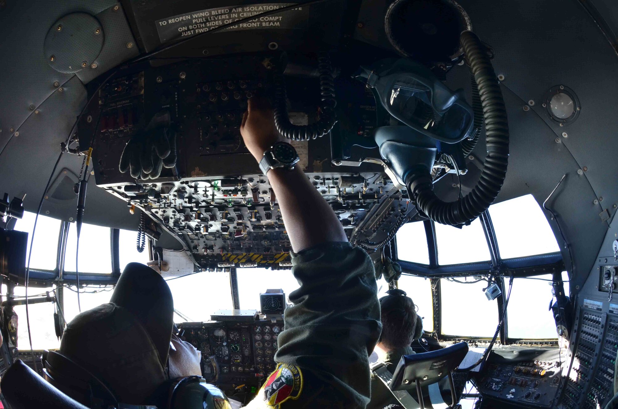 Pilots from the 36th Airlift Squadron, Yokota Air Base, Japan, perform in-flight checks prior to their departure for an Operation Christmas Drop delivery flight Dec. 14, 2012, from Andersen Air Force Base, Guam. Each year OCD provides aid to more than 30,000 islanders in Chuuk, Palau, Yap, Marshall Islands and Commonwealth of the Northern Mariana Islands. This year is the 61st anniversary of OCD, making it the longest running humanitarian mission in the world. In total, there are eight planned days of air drops, with 54 islands scheduled to receive humanitarian aid. (U.S. Air Force photo/Staff Sgt. Alexandre Montes/Released)