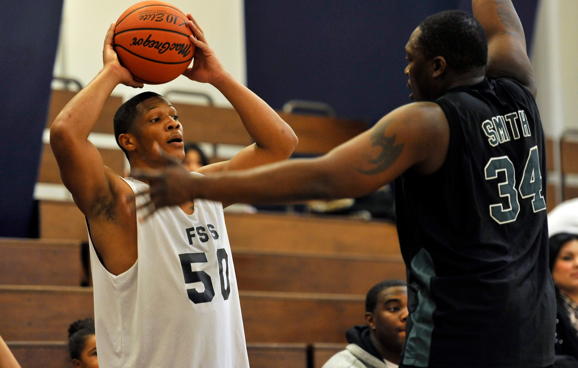 Johnny Smith, right, 35th Civil Engineer Squadron Team B center, defends an inbound pass as Lorenzo Lewis, 35th Force Support Squadron guard, looks for open teammates during their game at Misawa Air Base, Japan, Dec. 12, 2012. The 35 FSS and 35 CES Team B played a back and forth game until the end, but a last second traveling violation on Smith locked up the victory for the 35 FSS 64-62. (U.S. Air Force photo by Airman 1st Class Zachary Kee)