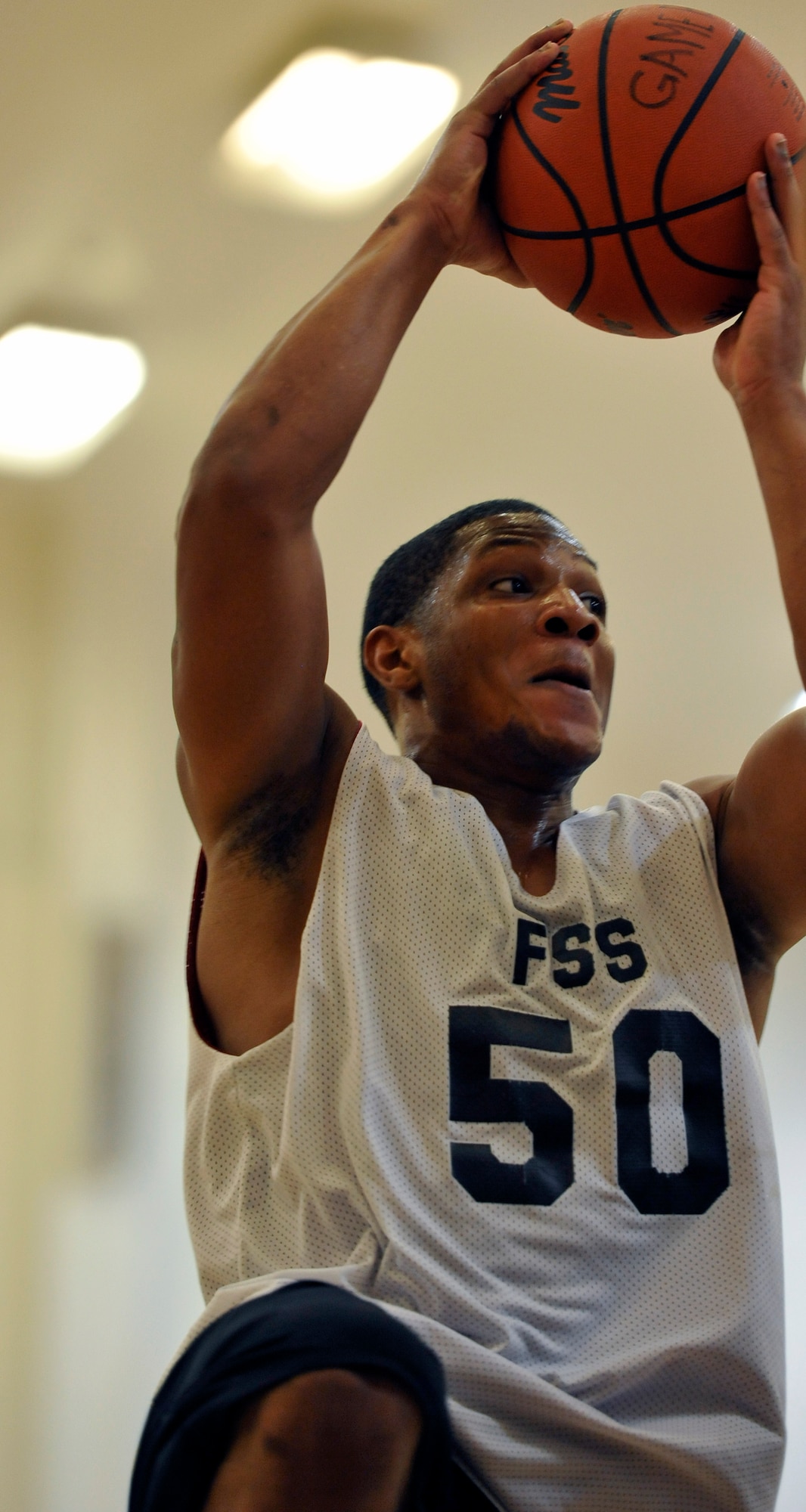 Lorenzo Lewis, 35th Force Support Squadron guard, goes for a layup during his team’s game against the 35th Civil Engineer Squadron Team B at Misawa Air Base, Japan, Dec. 12, 2012. The game came down to the wire as the 35 FSS secured the victory 64-62 on a last second traveling violation on the 35 CES Team B. (U.S. Air Force photo by Airman 1st Class Zachary Kee)
