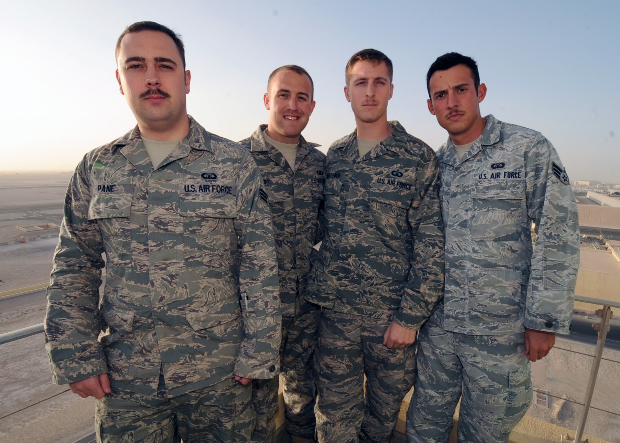 SOUTHWEST ASIA - From left to right, Senior Airman Nicholas Pane, Senior Airman John Stoke, Staff Sgt. Luke Hightower and William Wright are all air traffic controllers assigned to the 379th Expeditionary Operations Support Squadron. In order to be certified as a controller, the Airmen had to attend a four month technical school and then approximately another year of on-the-job training. (U.S. Air Force photo/Senior Airman Joel Mease)