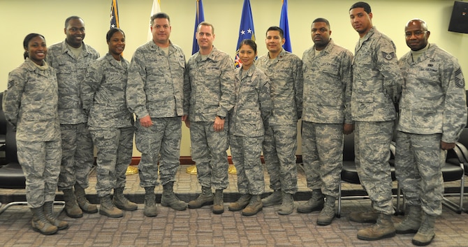Osan leaders pose for a photo with the NCOs who went above and beyond to help a fellow Airmen with a personal battle. These NCOs were coined for their exemplary service Dec. 12, 2012 in the 7th Air Force conference room. (U.S. Air Force photo/Senior Airman Kristina Overton) 

