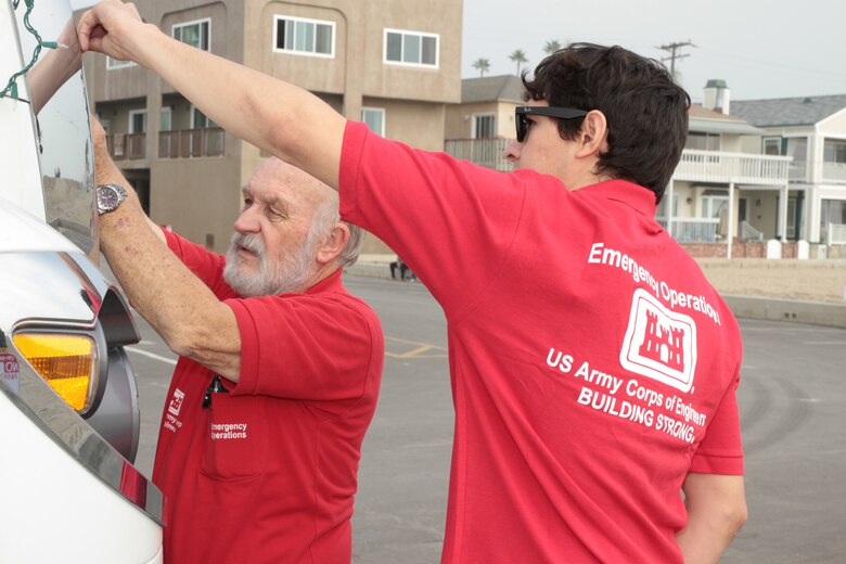 ECCV operator Alex Watt and Emergency Operations Center intern Tito Carrillo spent a few hours getting the 47-foot vehicle, designed to serve as a temporary mobile command post, decked out for the evening's festivities. The District made its first appearance in the Seal Beach Christmas Parade which featured 110 marching groups and more than 3,600 participants Dec. 7.