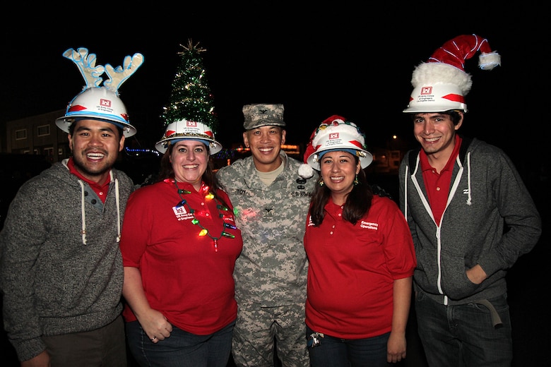 U.S. Army Corps of Engineers Los Angeles District making its first appearance in the annual Seal Beach Christmas Parade. Getting in the holiday spirit are from left to right: David Tran, Mindy Grupe, Col. Mark Toy, Noemi Rodriguez and Tito Carrillo. The parade made its way down historic Main Street in Old Town past kids of all ages Dec. 7.