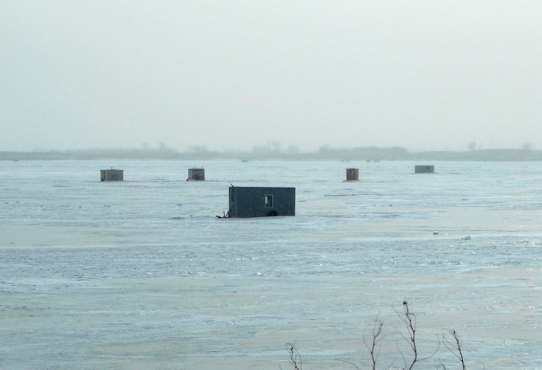 Each winter, as the temperatures drop and the ice thickens, fisherman set up temporary structrues on Lake Sakakawea to support fishing on the ice.