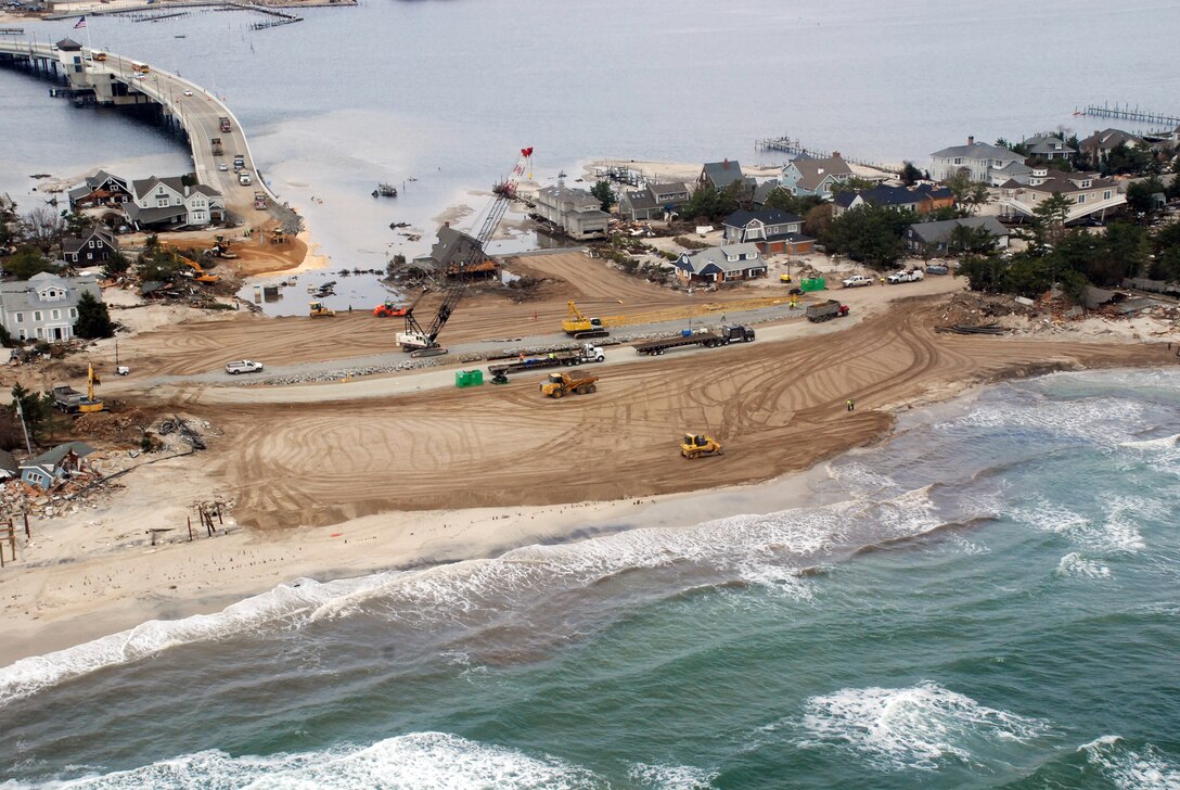 The U.S. Army Corps of Engineers worked rapidly to repair a levee breach caused by Hurricane Sandy in Mantoloking, N.J. The breach occurred at the end of the only bridge onto the barrier island, effectively cuting it off from the rest of the state. At the peak of the response effort, the Corps had nearly 4,000 employees from across the nation engaged in more than 38 FEMA mission assignments, exceeding a total of $134 million. (PHOTO BY MARY MARKOS, ST.LOUIS DISTRICT) (Photo by MARY MARKOS)

