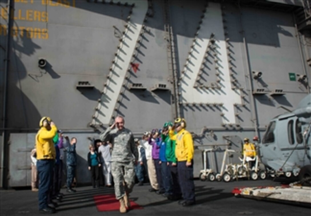 Chairman of the Joint Chiefs of Staff Gen. Martin E. Dempsey salutes as he passes through the side boys on the aircraft carrier USS John C. Stennis (CVN 74) while  the ship operates in the Persian Gulf on Dec. 13, 2012.   Athletes and entertainers accompanied Dempsey on the visit to the ship as part of his annual USO holiday tour.
The Stennis is deployed to the 5th Fleet area of responsibility to conduct maritime security operations and theater security cooperation efforts. 