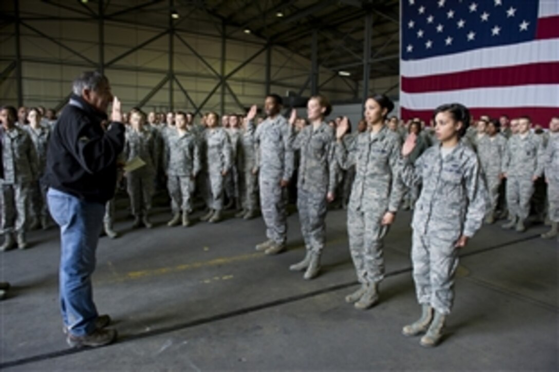 Defense Secretary Leon E. Panetta re-enlists four airmen on Incirlik Air Base, Turkey, Dec. 13, 2012. It was the last stop on the secretary's four-day trip to visit service members in Kuwait, Afghanistan and Turkey.