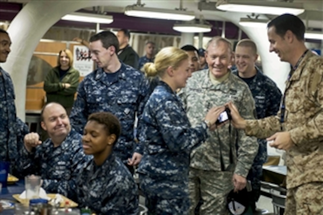 U.S. Army Gen Martin E. Dempsey, chairman of the Joint Chiefs of Staff, talks with sailors on the USS John C. Stennis in the Persian Gulf, Dec. 13, 2012.