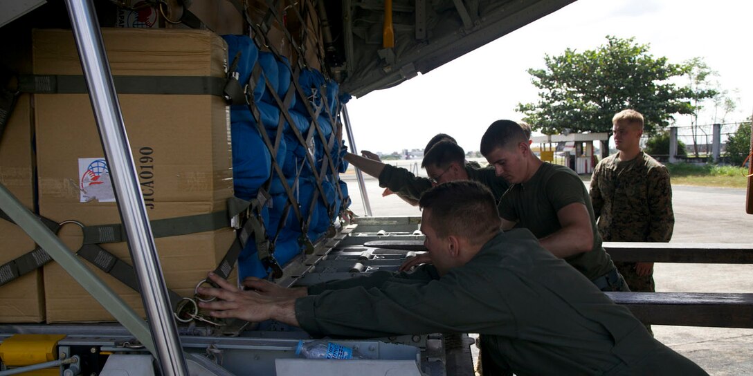 Marines load a pallet of supplies into a KC-130J Hercules aircraft Dec. 13 at Villamor Air Base in Manila, Republic of the Philippines. As of Dec. 13, Marines have transported approximately 440,000 pounds of relief supplies to the Mindanao region of the Philippines, which has seen the most devastating effects of Typhoon Pablo (international name Bopha). As supplies land in Mindanao, Philippine Government and nongovernmental organizations distribute them to displaced families throughout the region. The Marines are with Marine Aerial Refueler Transport Squadron 152, Marine Aircraft Group 36, 1st Marine Aircraft Group, III Marine Expeditionary Force. 